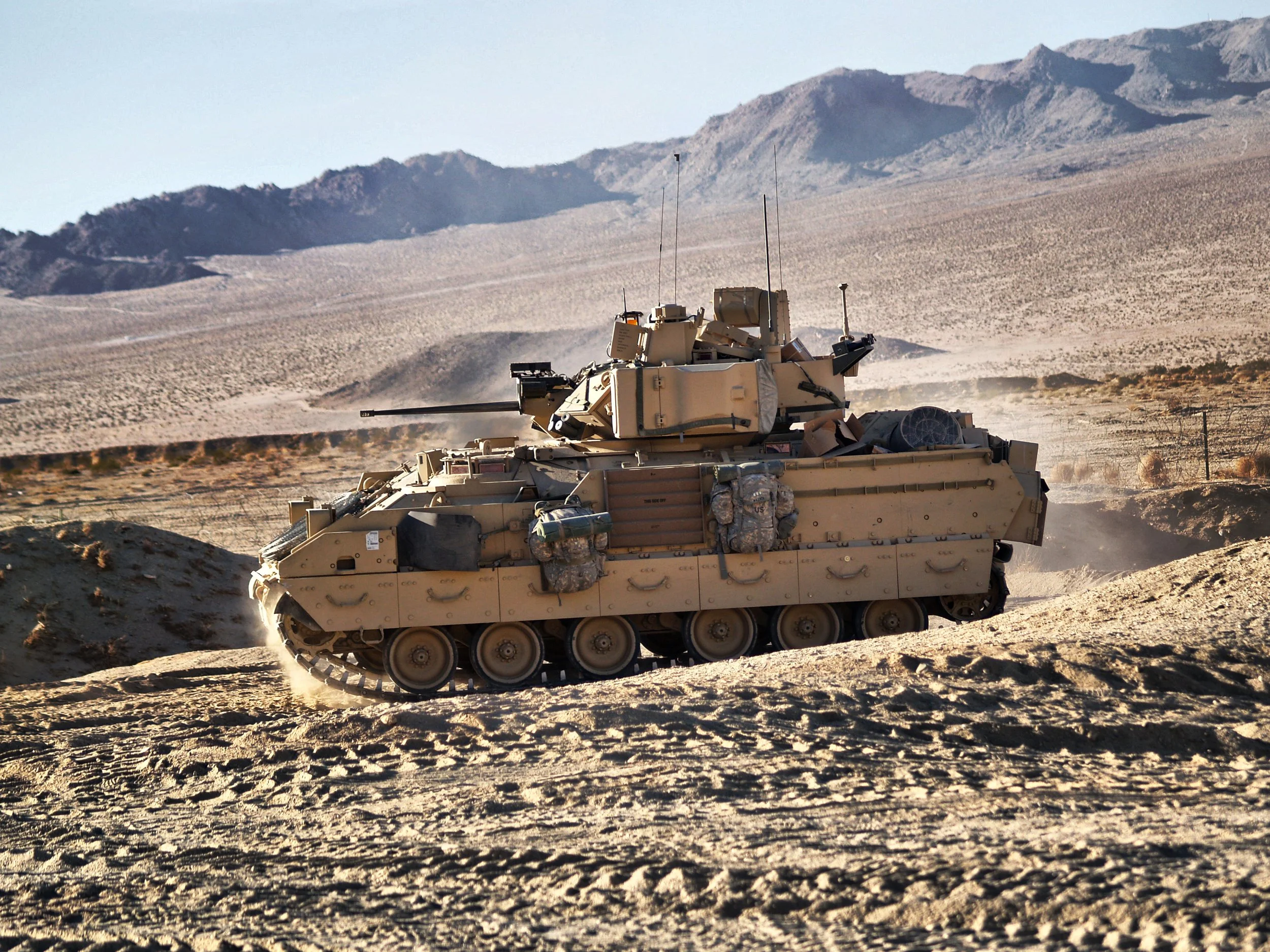 An M2A2 Bradley enters a JSS at Medina Wasl, the National Training Center, Fort Irwin California circa 2012. 