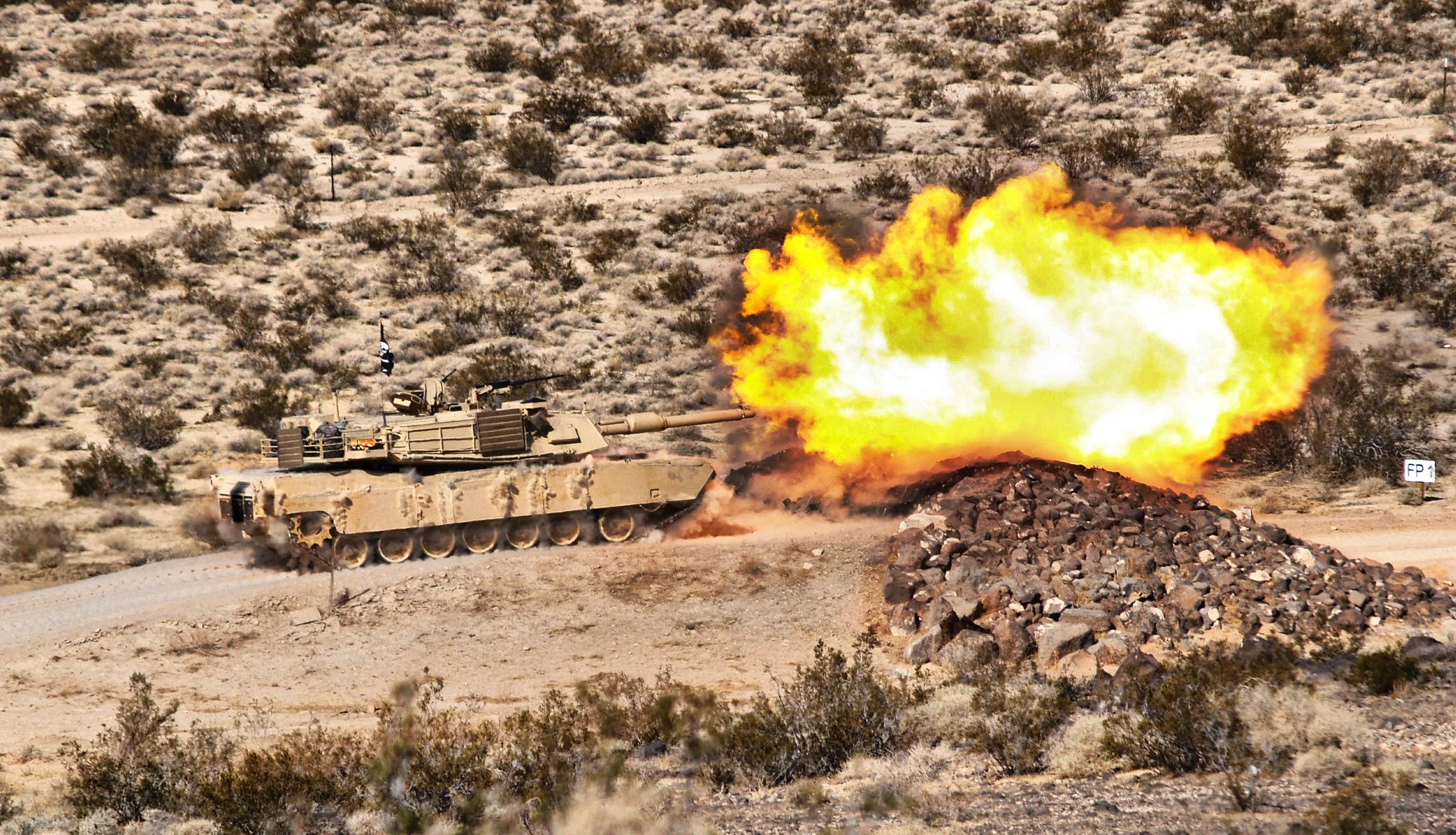 A Tank from Fury Troop, 2-11 ACR conducts Gunnery Live Fire from a M1 Abrams at Fort Irwin, California circa 2012. 