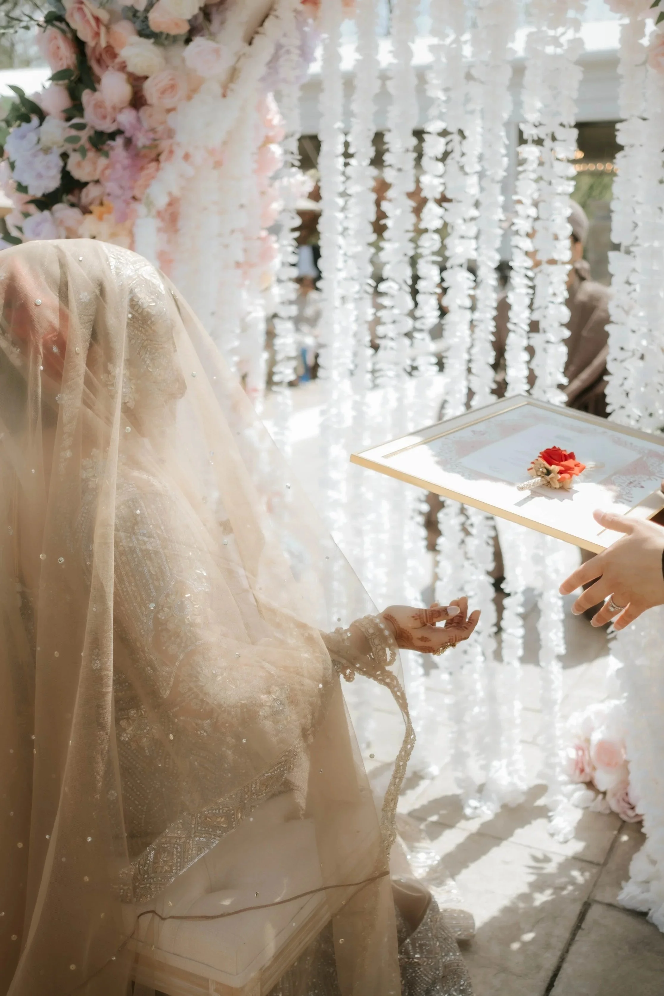 Bride signing nikah contract at White’s Ferry Manor during South Asian wedding in Leesburg Virginia
