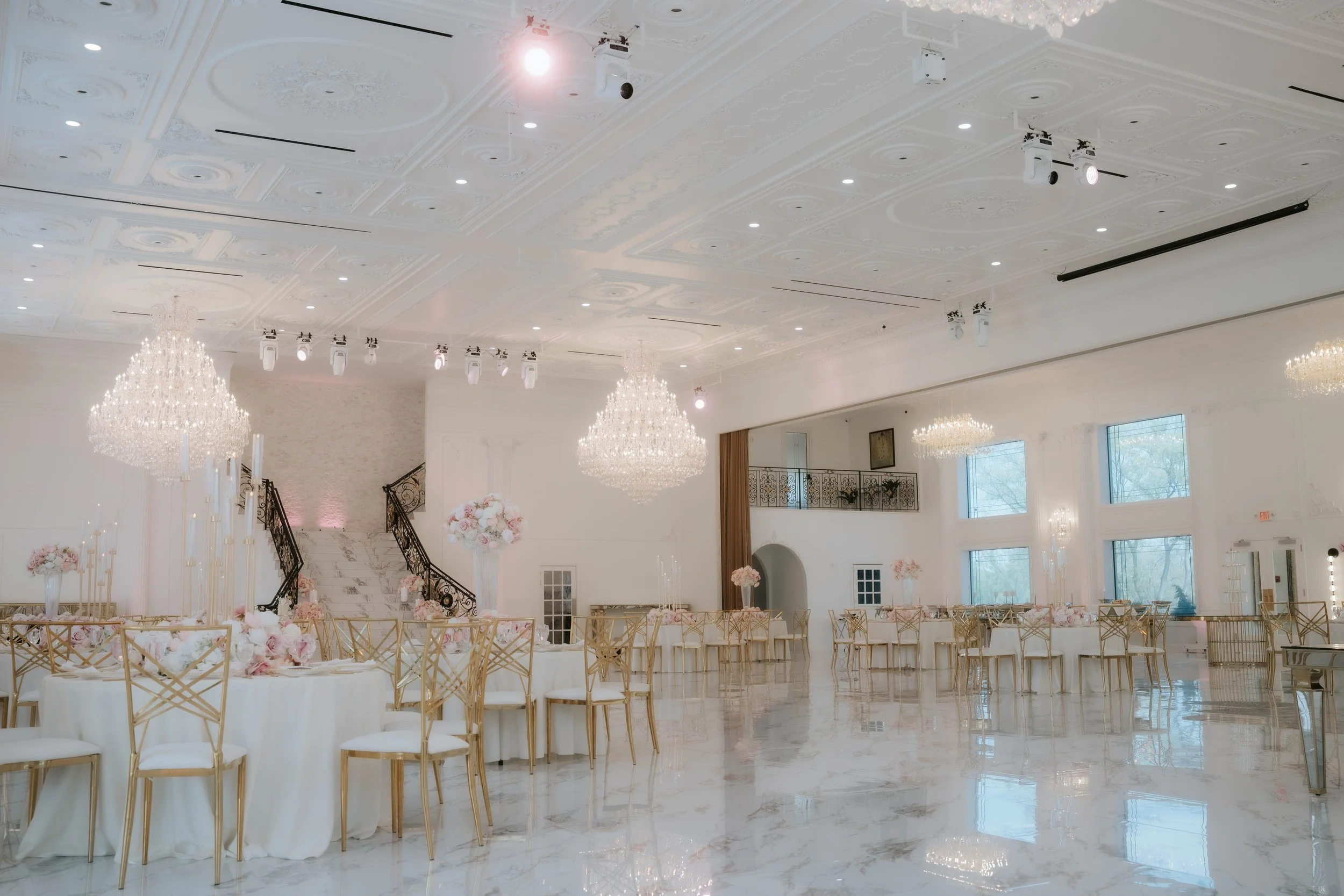 Ballroom reception at White’s Ferry Manor in Leesburg VA during an Indian fusion wedding with chandeliers and elegant decor