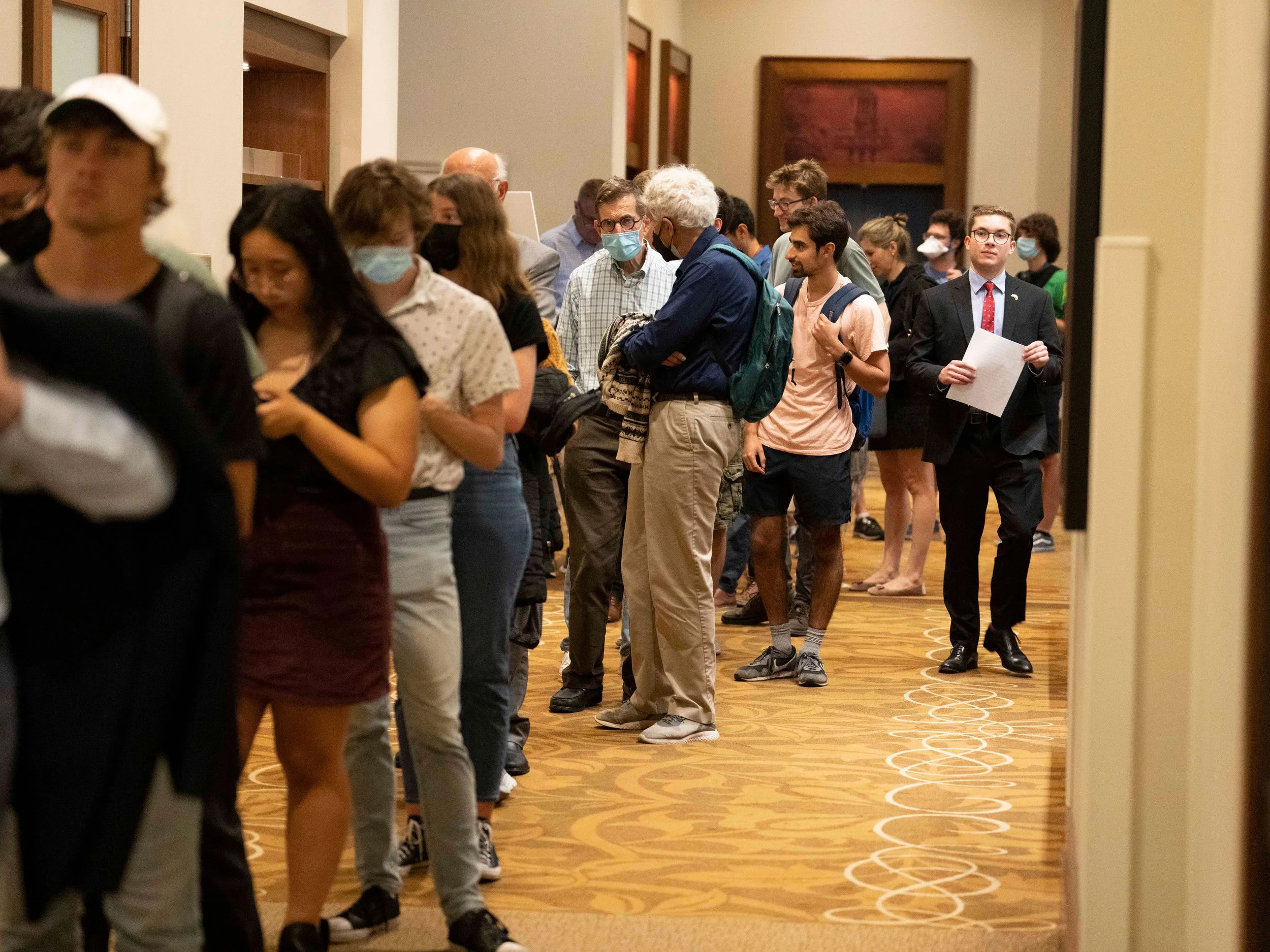 Silverstein inspecting the overflowing line of attendees waiting to enter the amphitheater for President Walesa's speech at the University of Texas.