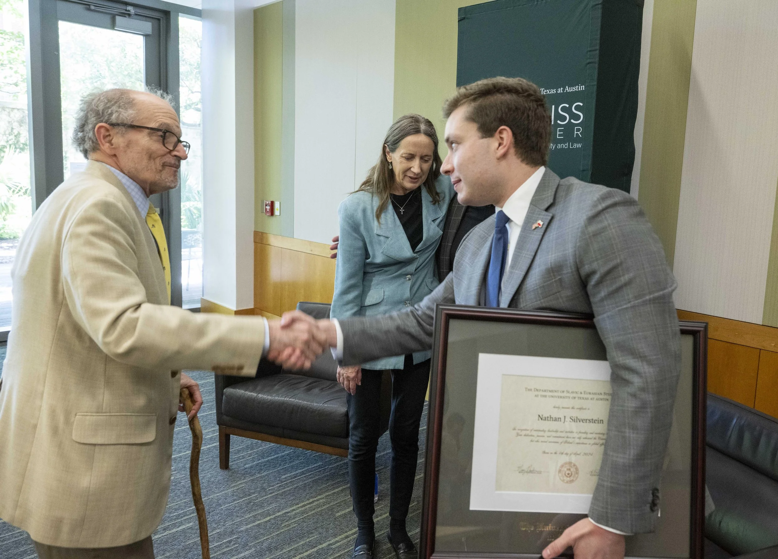 Thanking Ambassador Fried while holding a certificate of leadership and accomplishment awarded by the Center for Russian, East European, and Eurasian Studies.