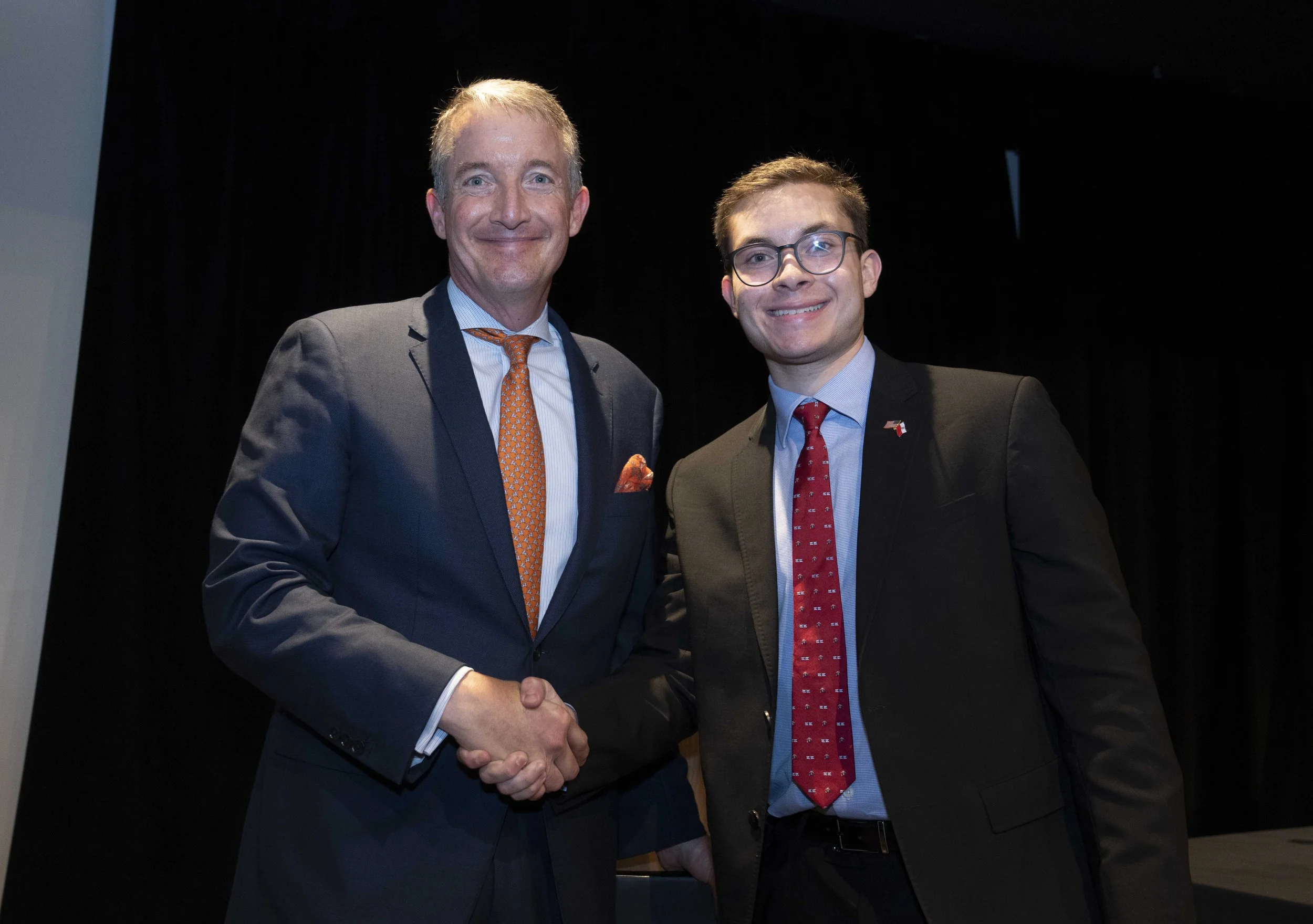 Shaking hands with University of Texas President Jay Hartzell at President Walesa's speech.