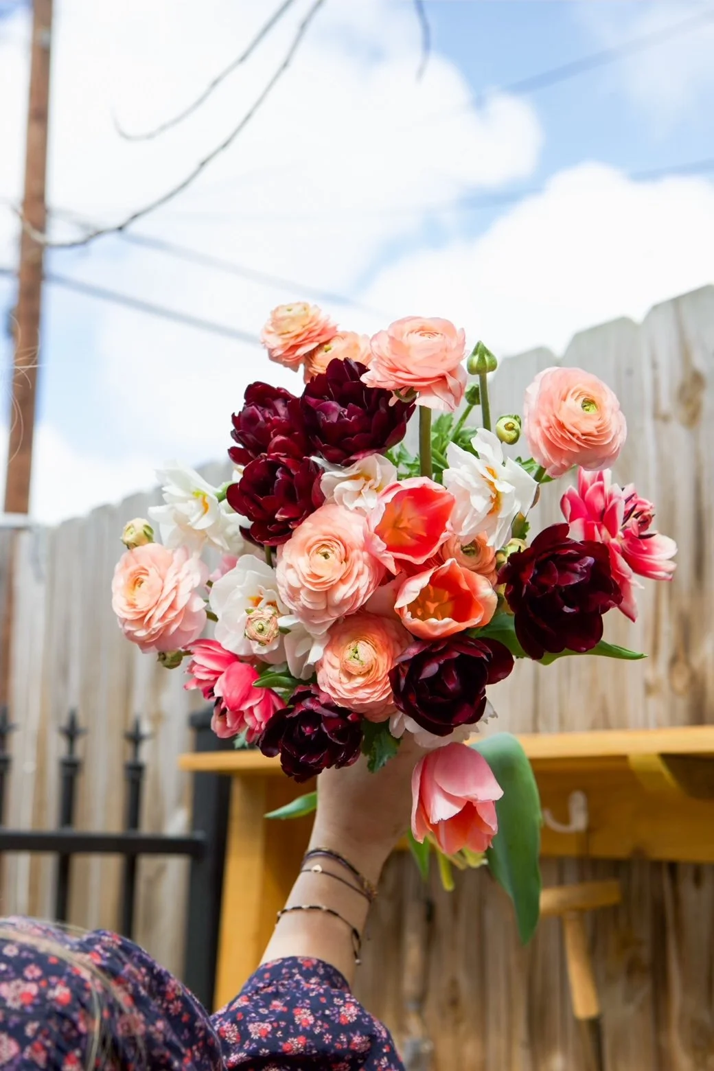 Bouquet of ranunculus, tulips, and anemones, representing the cool-season flowers taught in the Autumn Grow Along.