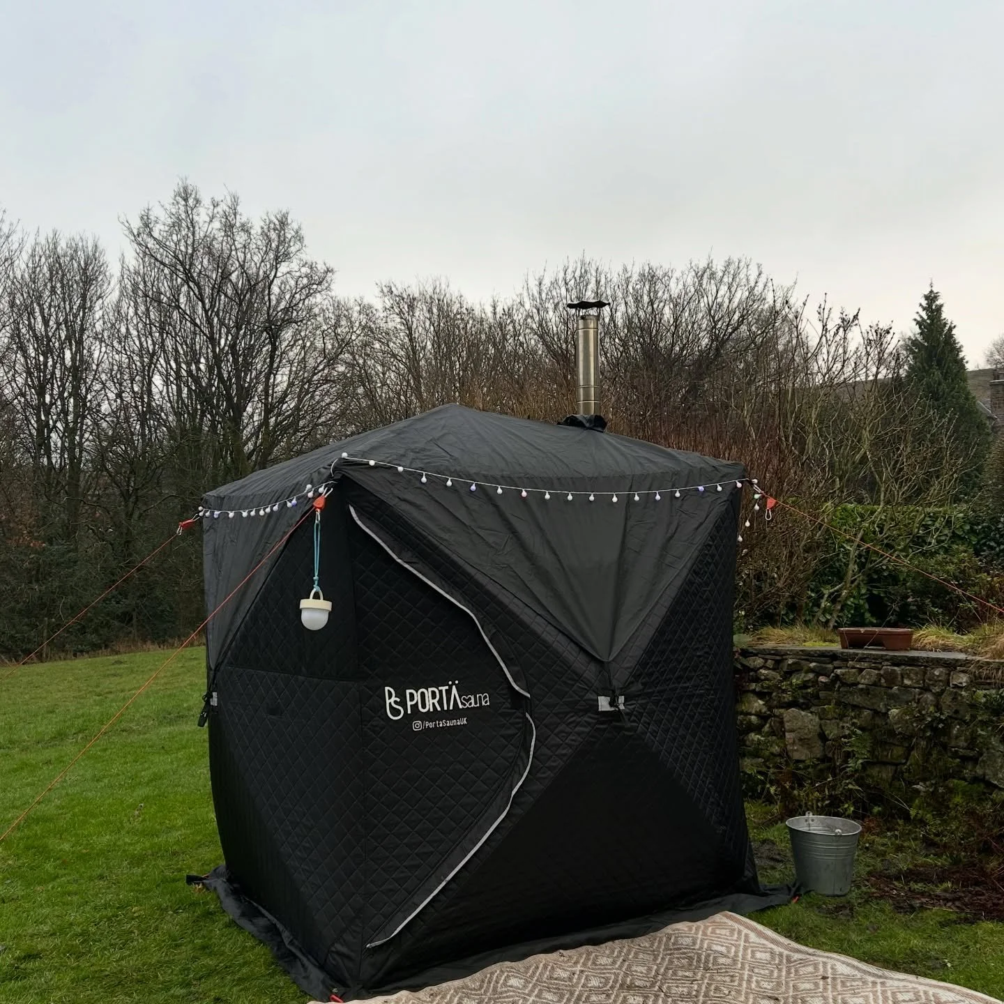 PortaSauna wood-fired tent set up in a back garden