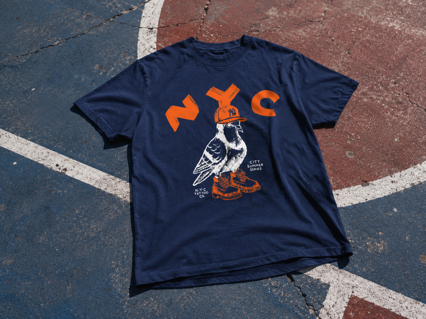 nyc pigeon wearing yankees hat and timberland boots t-shirt on basketball court in New York