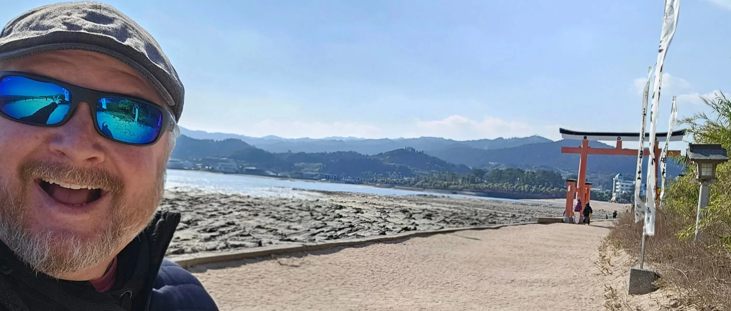 Mike in front of a torii gate at the Aoshima Shrine