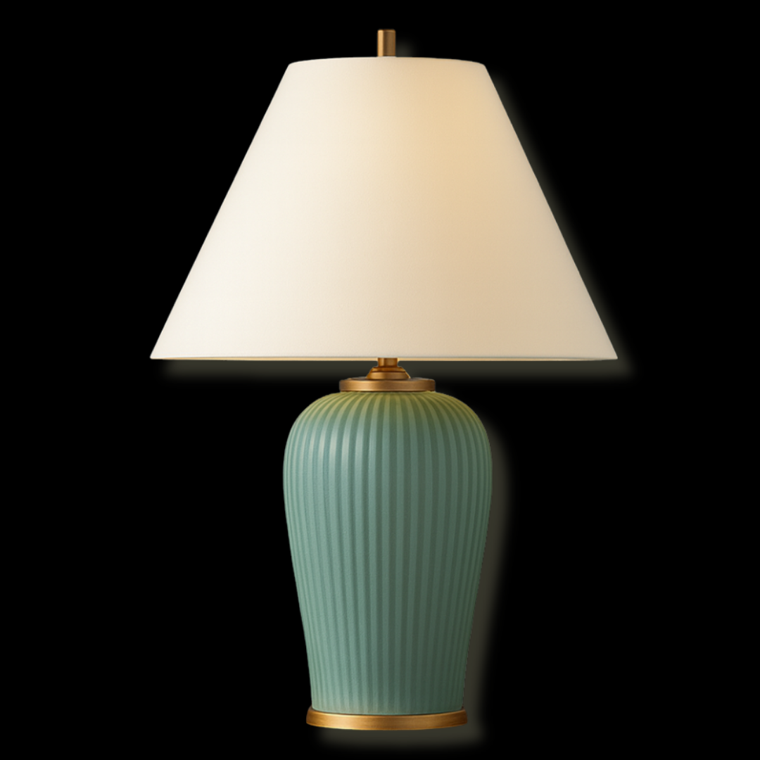 A ceramic table lamp with a green, ribbed base and a white lampshade against a black background.