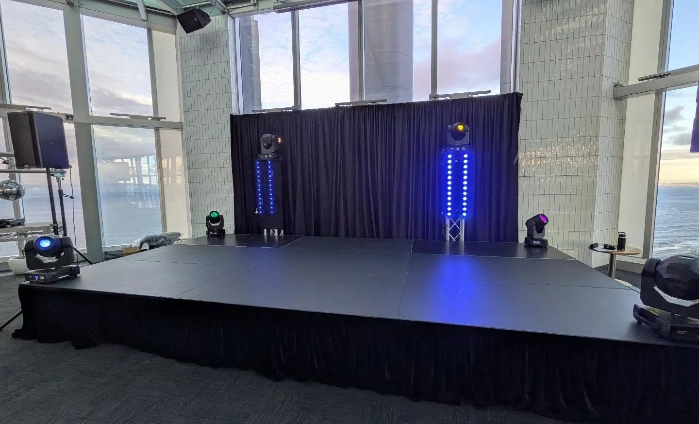 6x3m stage deck system at 600mm high with black velour skirt and stairs