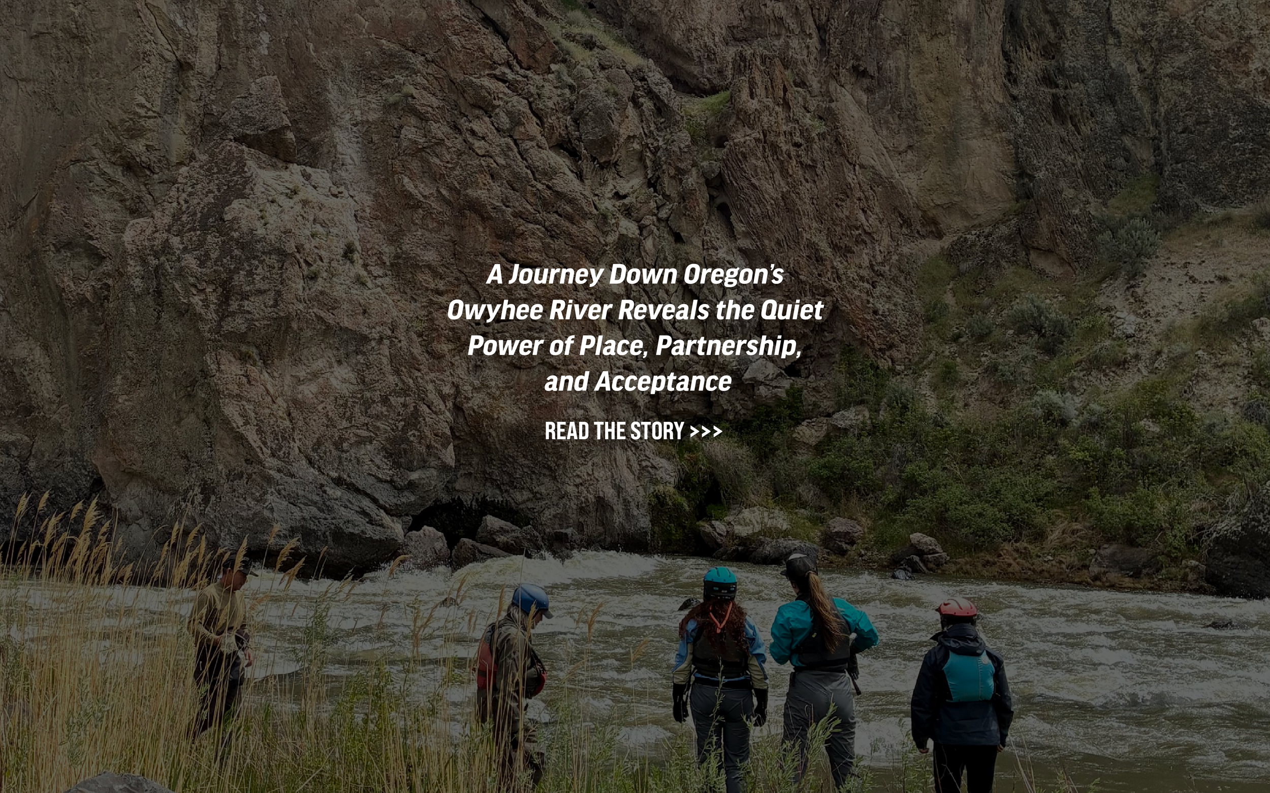 Several paddlers observing the Owyhee River.  Text that reads "A Journey Down Oregon’s Owyhee River Reveals the Quiet Power of Place, Partnership, and Acceptance." a button to read more is on the image.