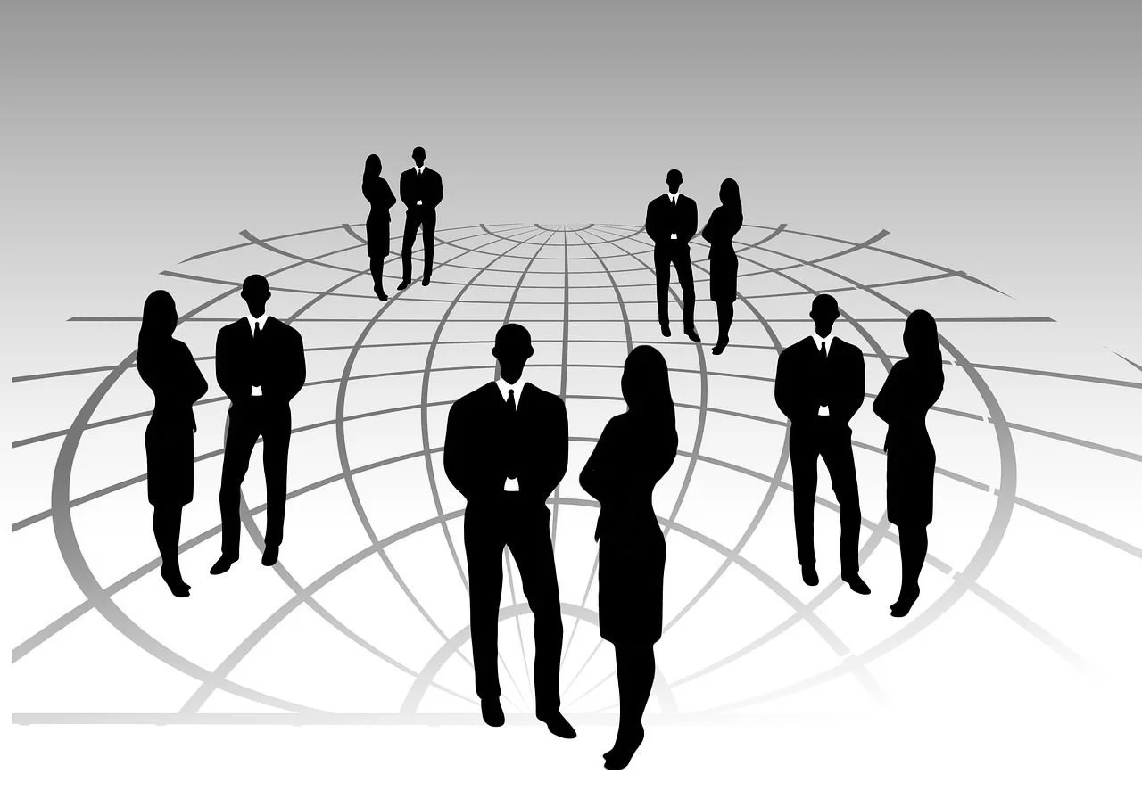 Silhouettes of nine businesspeople standing on a 3D globe grid, facing different directions, set against a gray background.