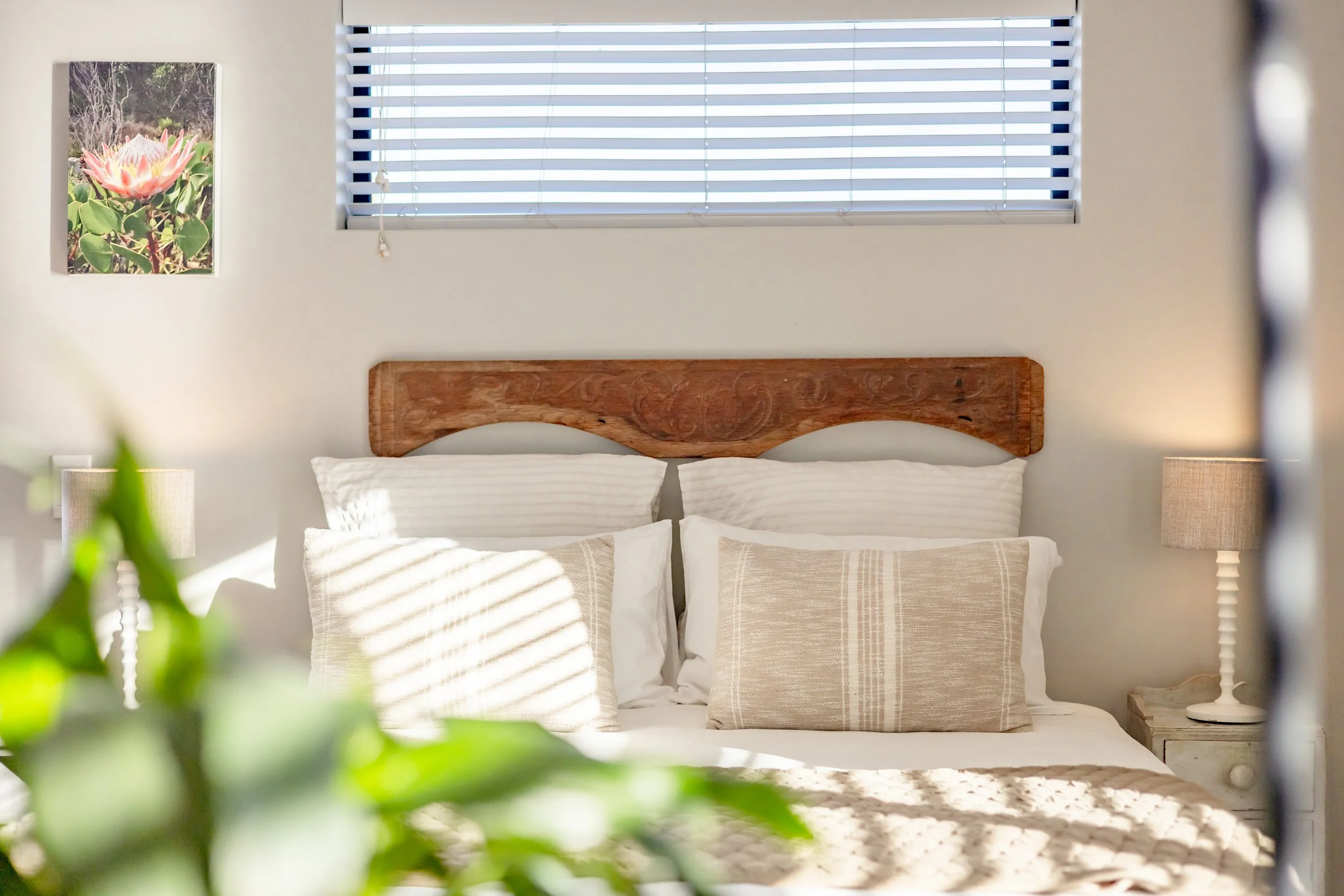 Bright guest bedroom with natural light professionally photographed for an Airbnb and holiday rental in Cape Town.