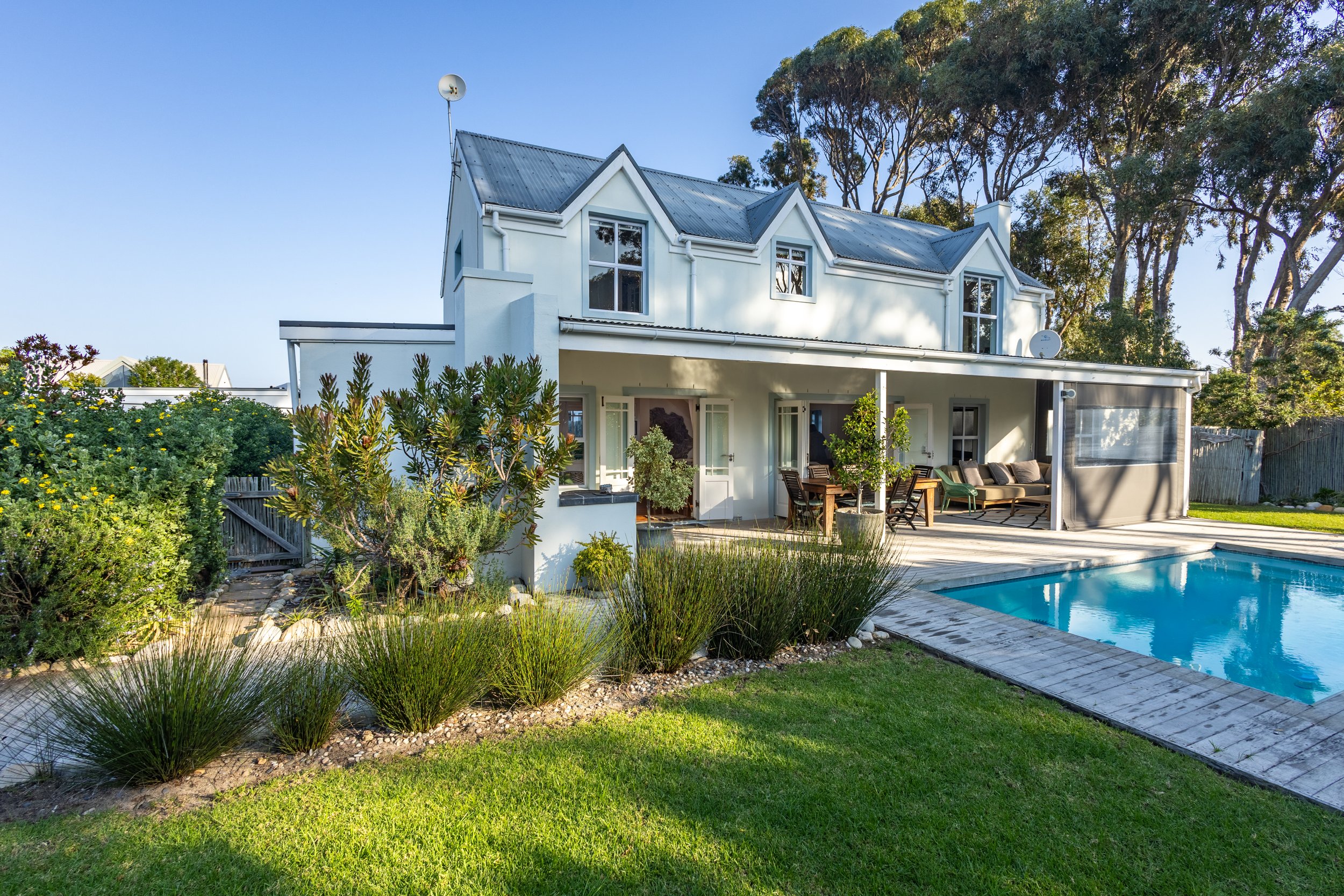 Exterior photograph of a modern luxury home with landscaped garden captured for residential property marketing in Cape Town.