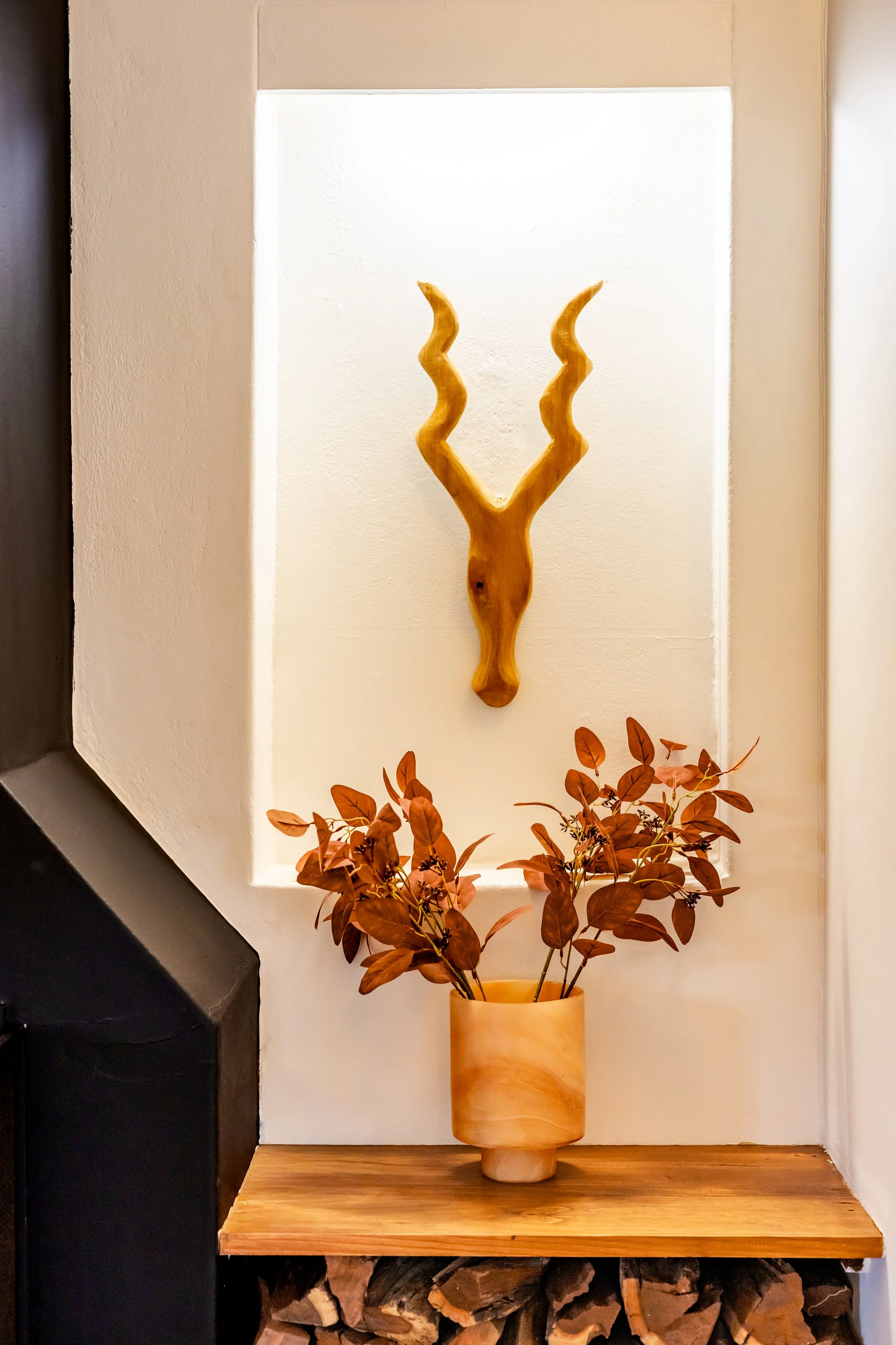 Styled interior décor featuring antelope horns and warm natural tones photographed for a luxury Cape Town home.