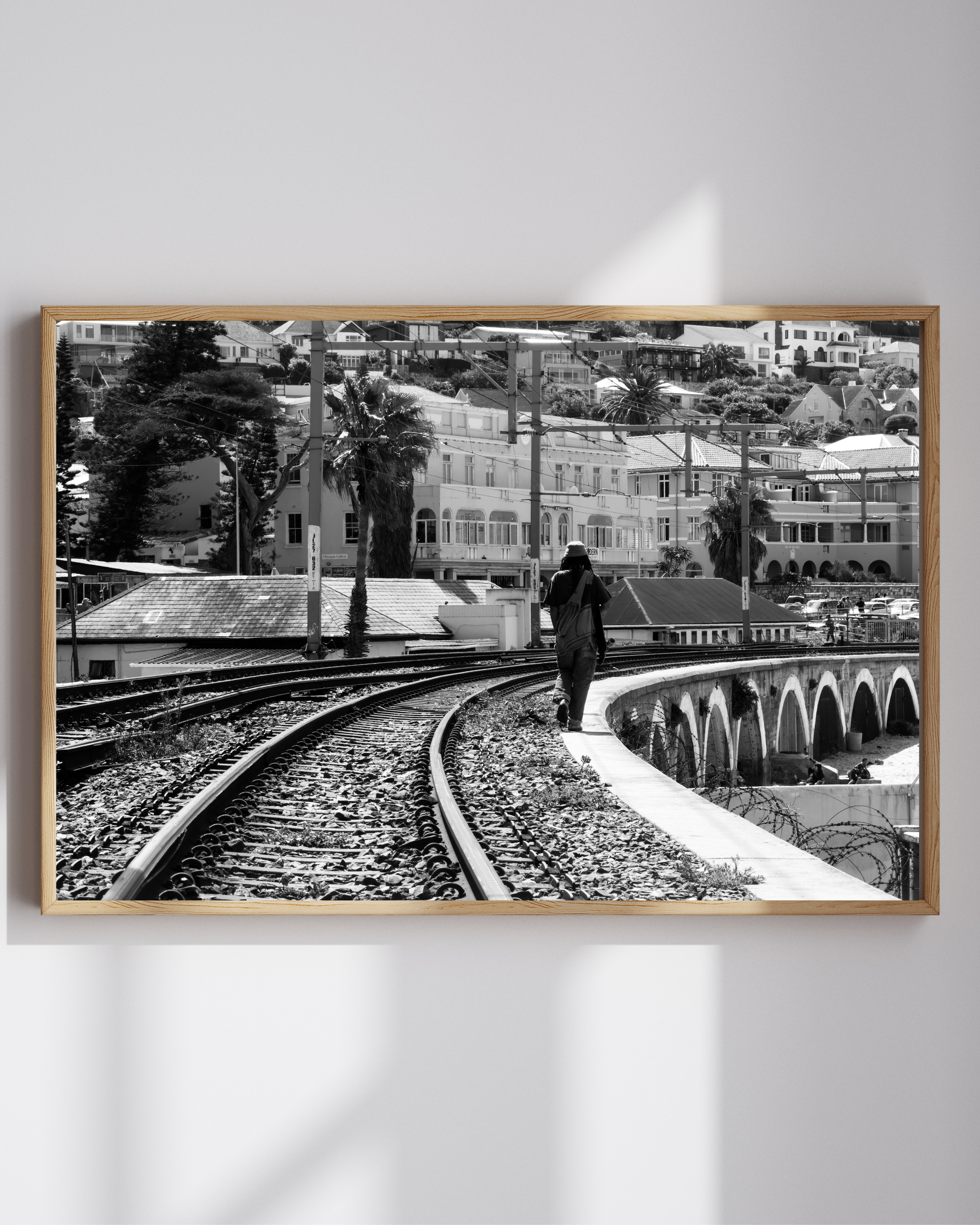Shop this classic black and white print of the historic Kalk Bay railway tracks by MadEye Photography. Bring the timeless charm of the Cape Town coastline into your home.