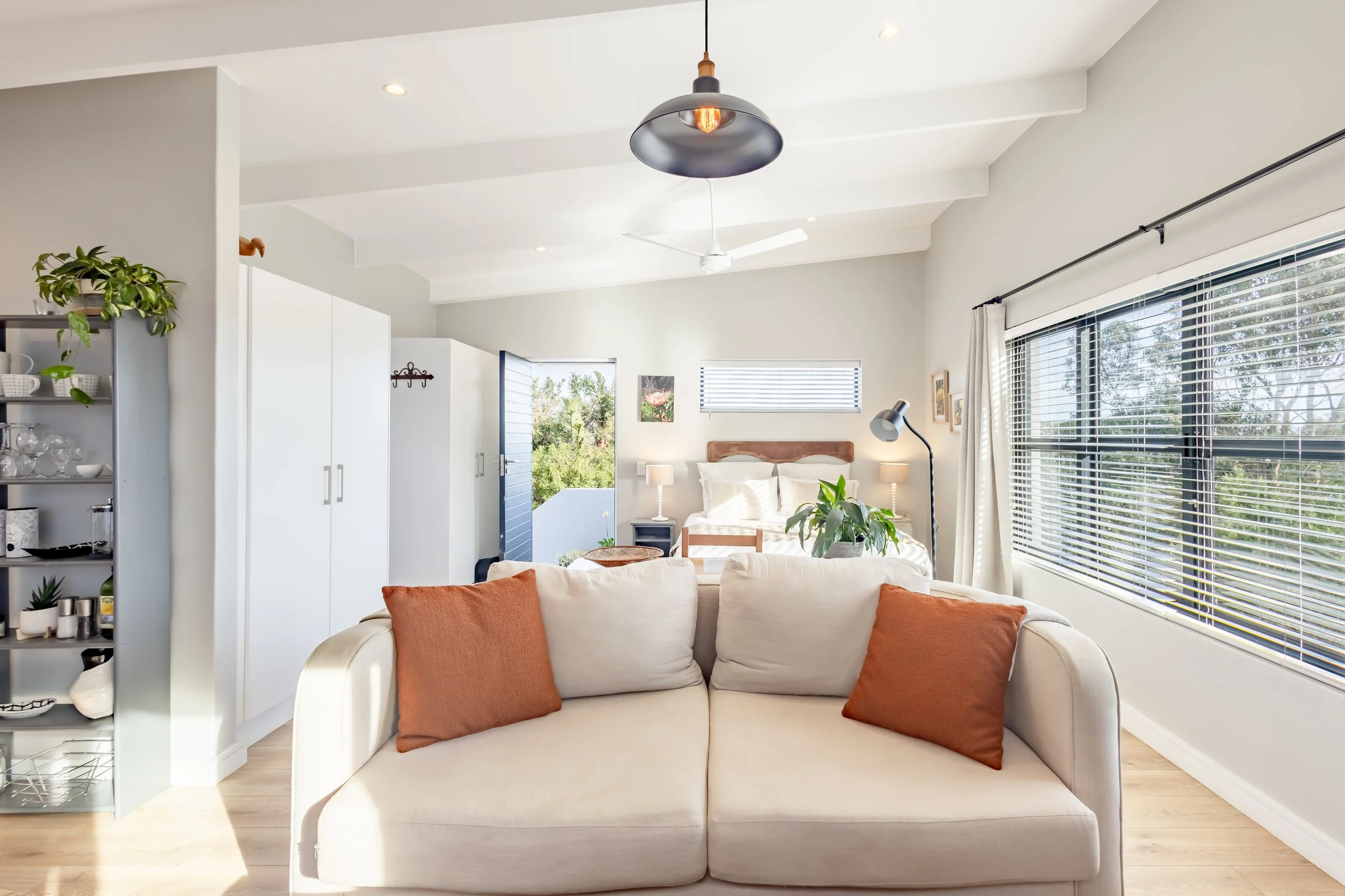 Contemporary open-plan lounge and kitchen professionally photographed for a residential property and Airbnb listing in Cape Town.