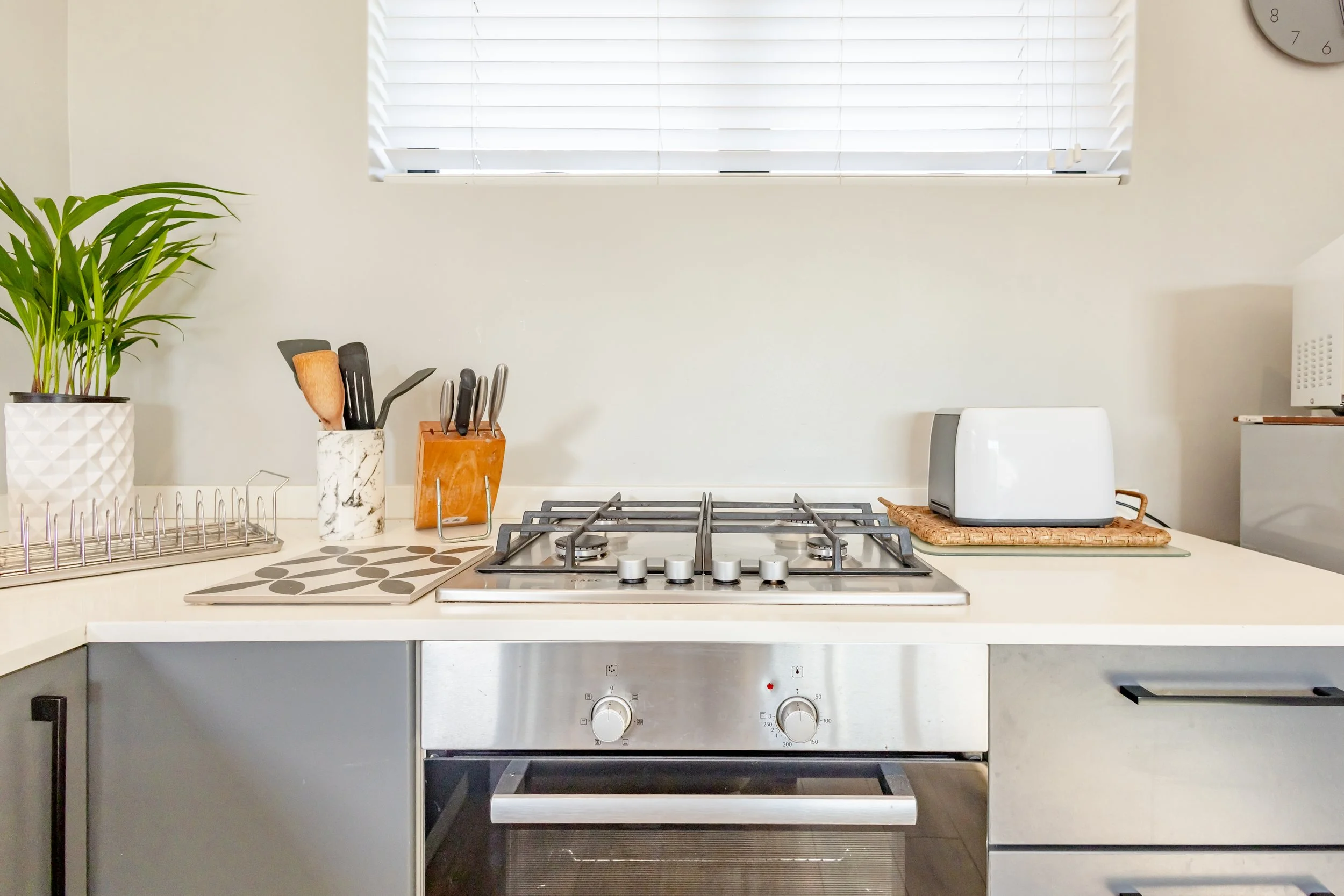 Modern kitchen with built-in gas hob and clean finishes photographed for a residential property in Cape Town.