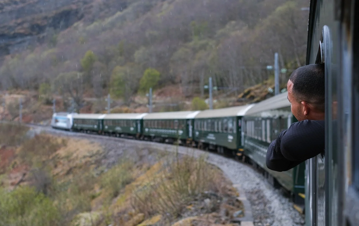 Flåm Railway. Person with head out of the window
