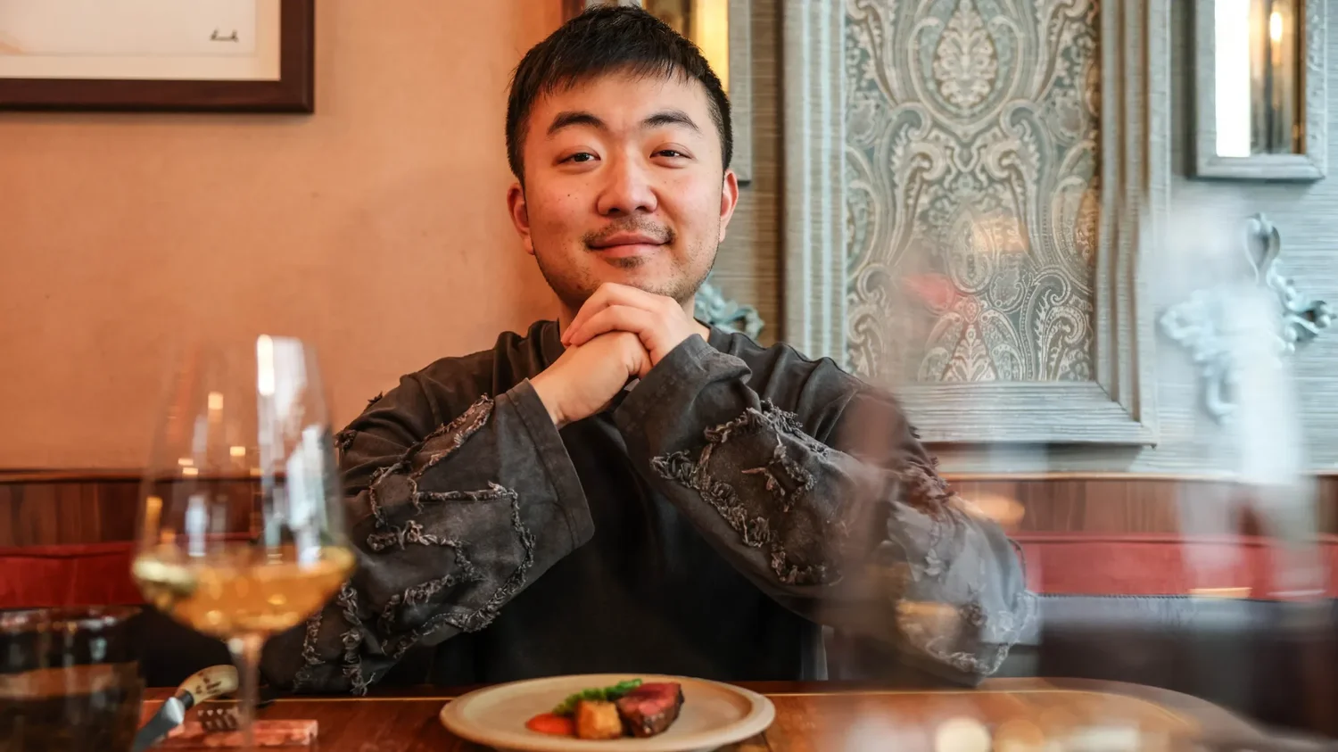 Carl Pei seated at a restaurant table