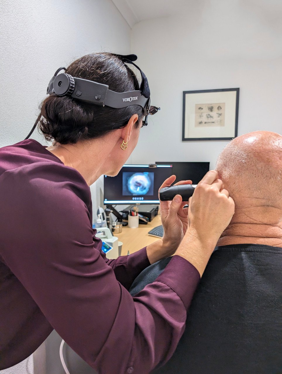 Belinda Seel performing video otoscopy ear assessment at Ear Revival Clinic Claremont