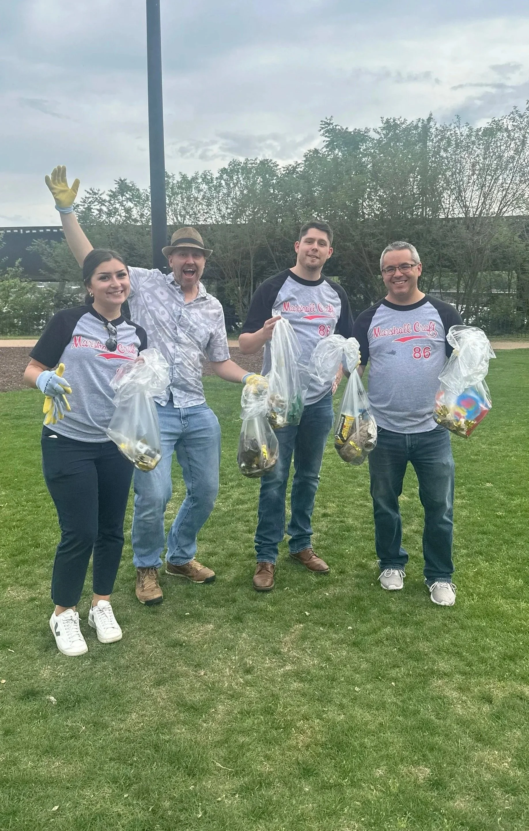 Richmond team holding bags of trash they collected on Earth Day 2025.