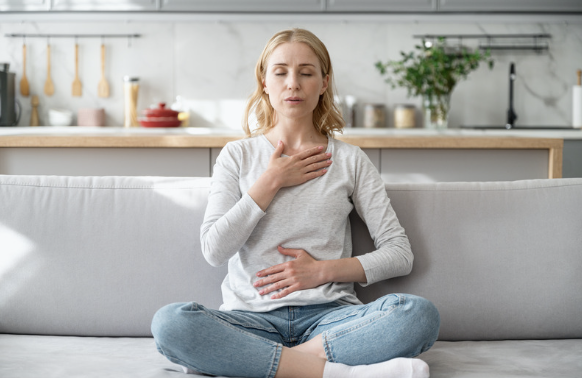 A woman feeling a sense of calm after acupuncture