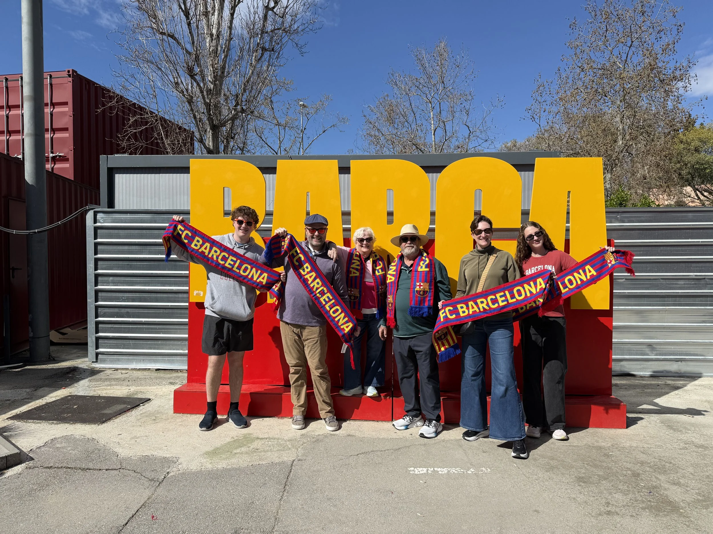 Family group posing at FC Barcelona Spotify Camp Nou stadium