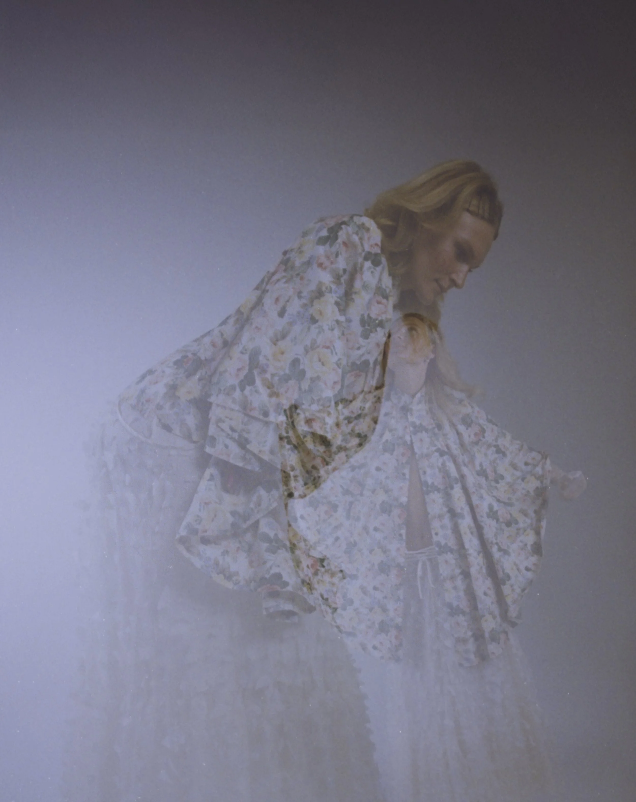 Blonde model in a lace kimono-style dress, softly blurred in a pale room. My Imaginary Friend by Hartenjager.