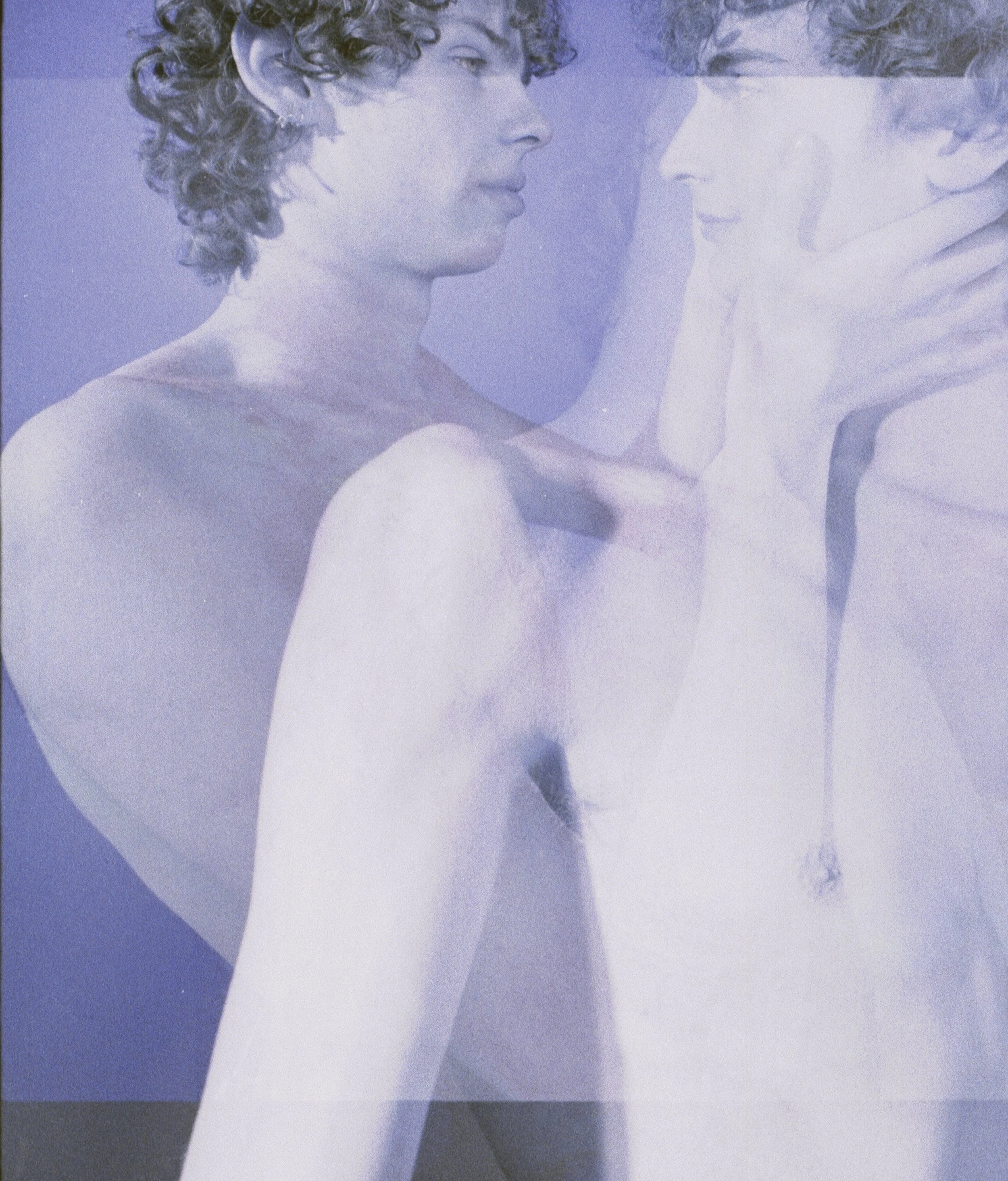 Shirtless curly-haired man with a second exposure of hands and bodies dissolving over him in blue. Geminus by Hartenjager.