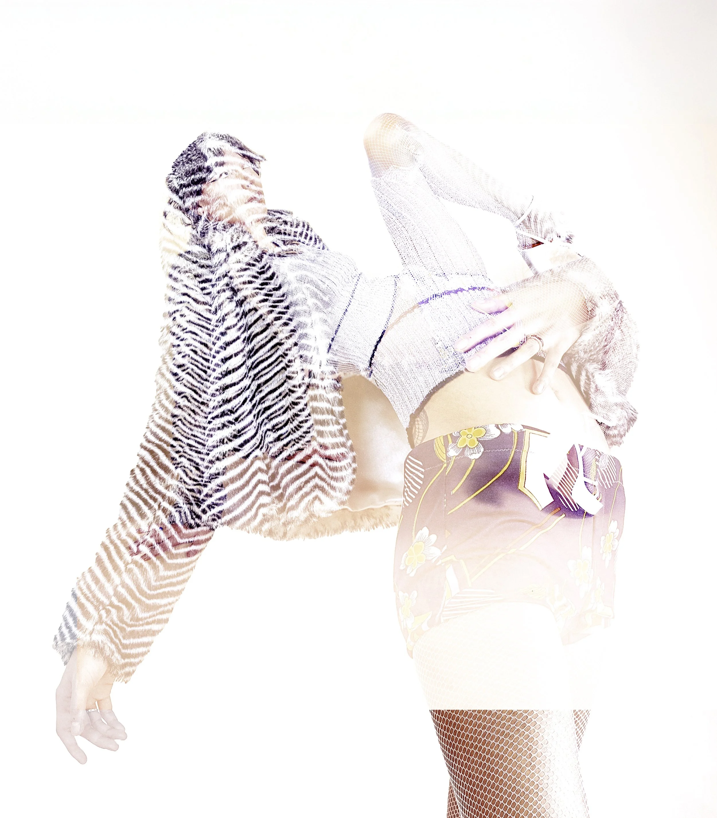 Overexposed multiple exposure of a model in a striped coat and fishnet tights, limbs overlapping. By Hartenjager.