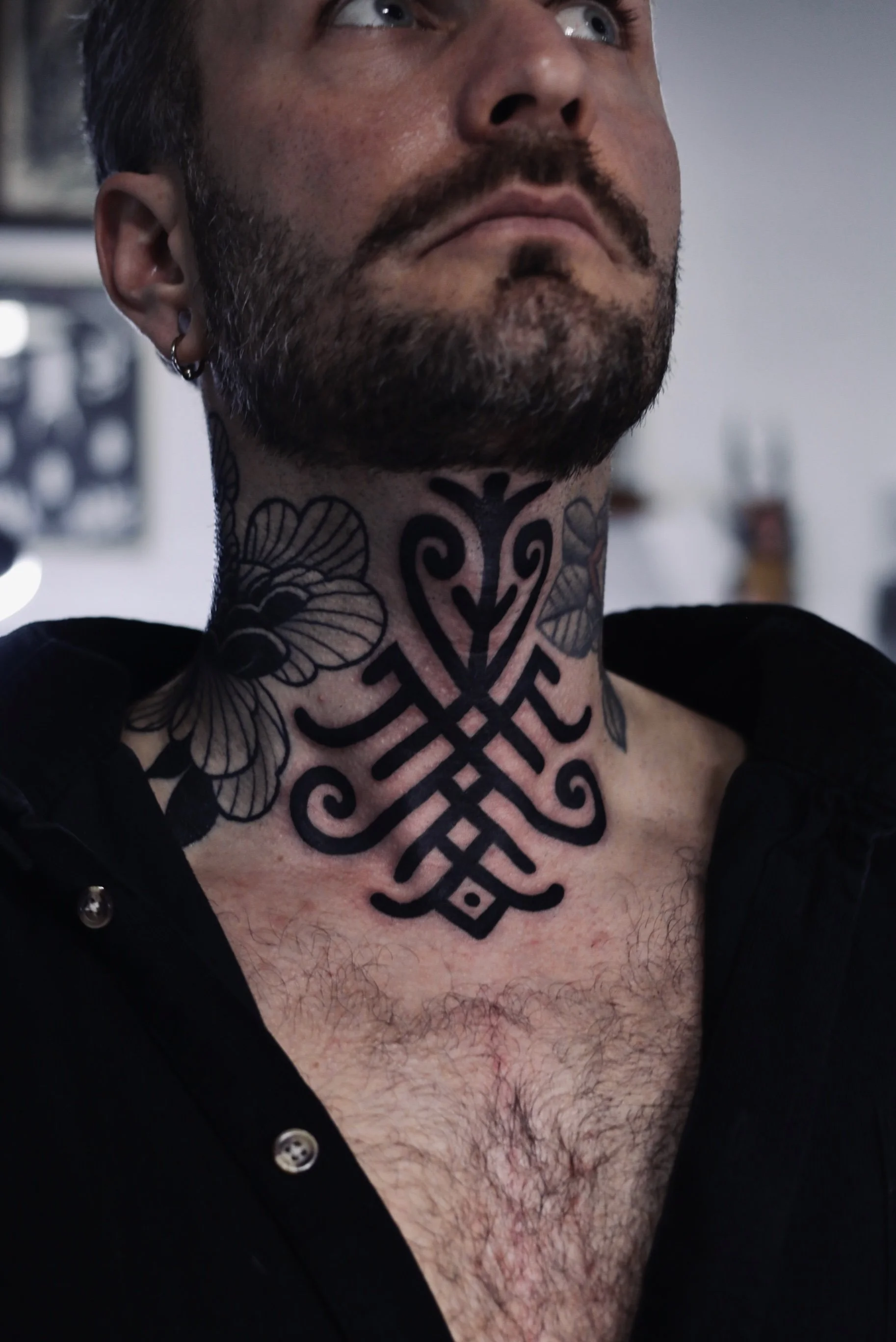 Bold Berber Blackwork Throat tattoo