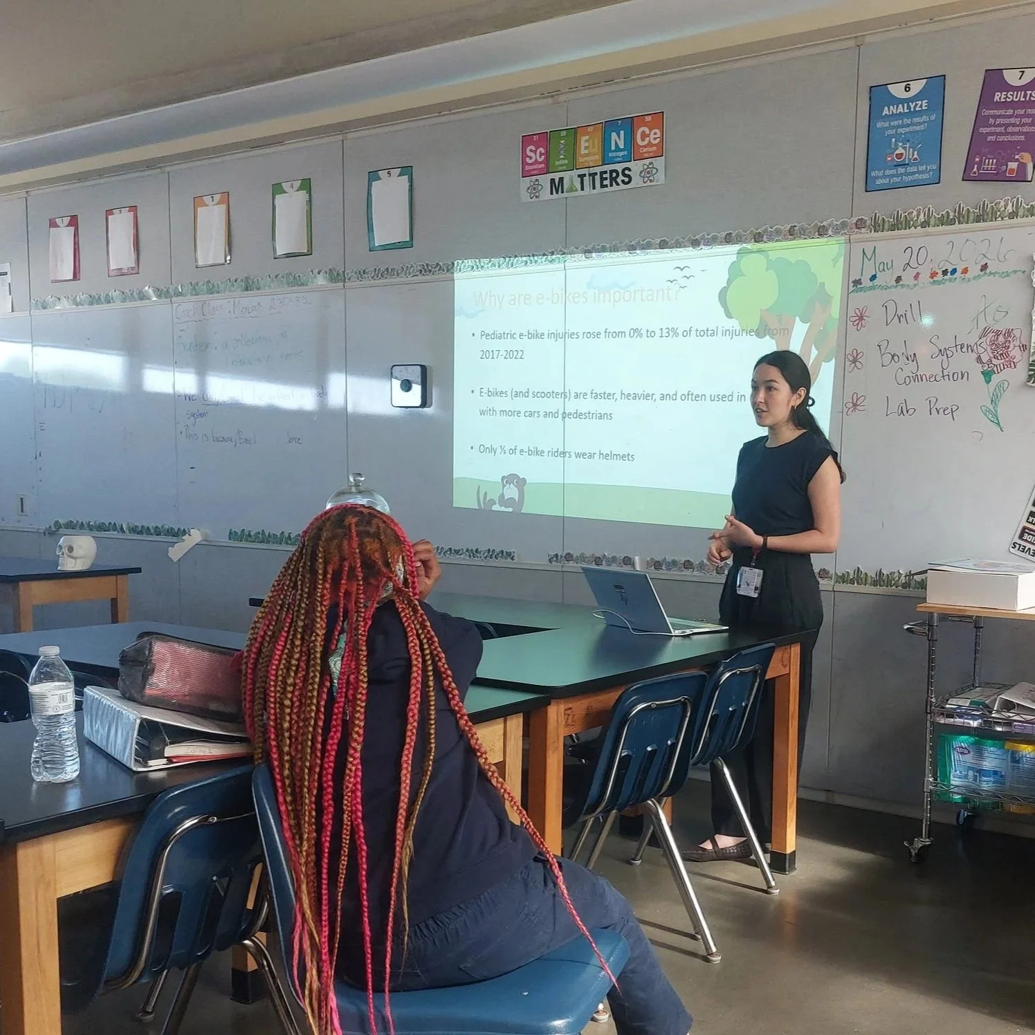 woman giving presentation in classroom