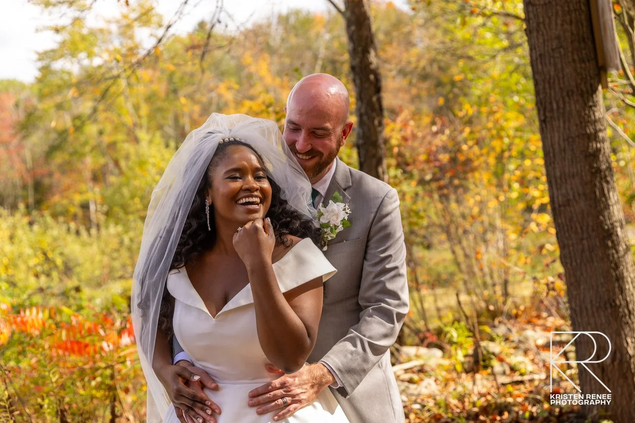 Bride and groom sharing a joyful portrait outdoors at Soul Fire Farm in New York