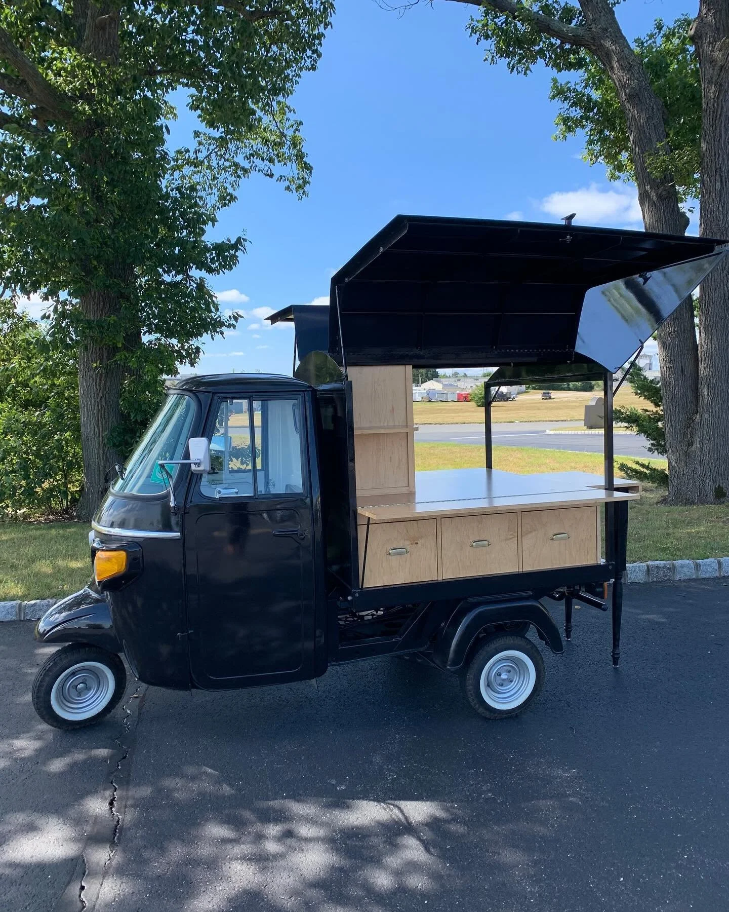 Available Now! $26,500. 2022 Piaggio Ape with Cafe setup. Features enclosed area to house up to two kegs. Drawers, RV plug to receive electric, and fold out bar surface. Great setup for someone looking to serve or display different products. DM for m
