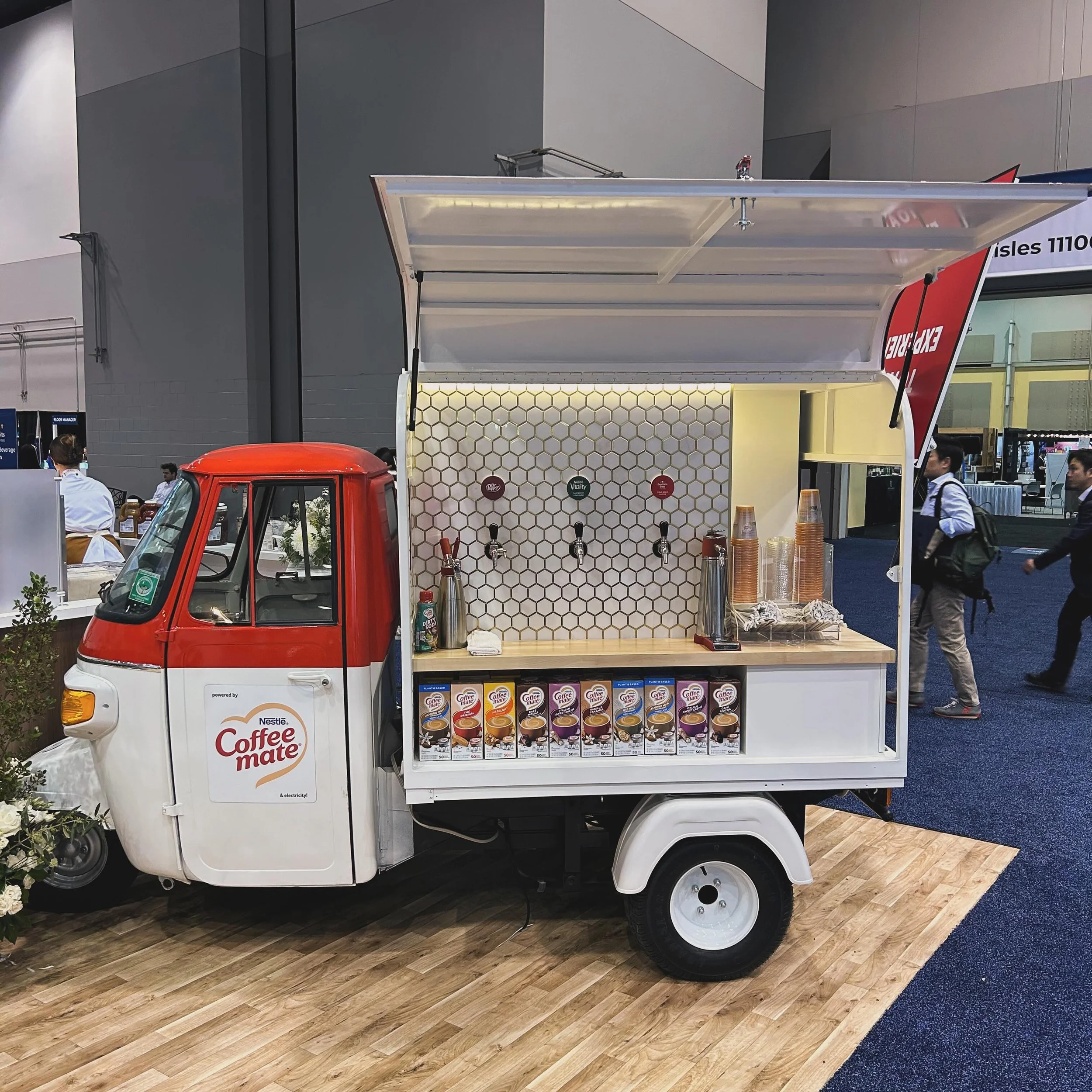 One of our apes out in the wild! We hear it&rsquo;s a big hit at the NRA Show 2024. #piaggioape #nrashow #taptruck #vintagetruckpurveyorsus #foodandbeverage