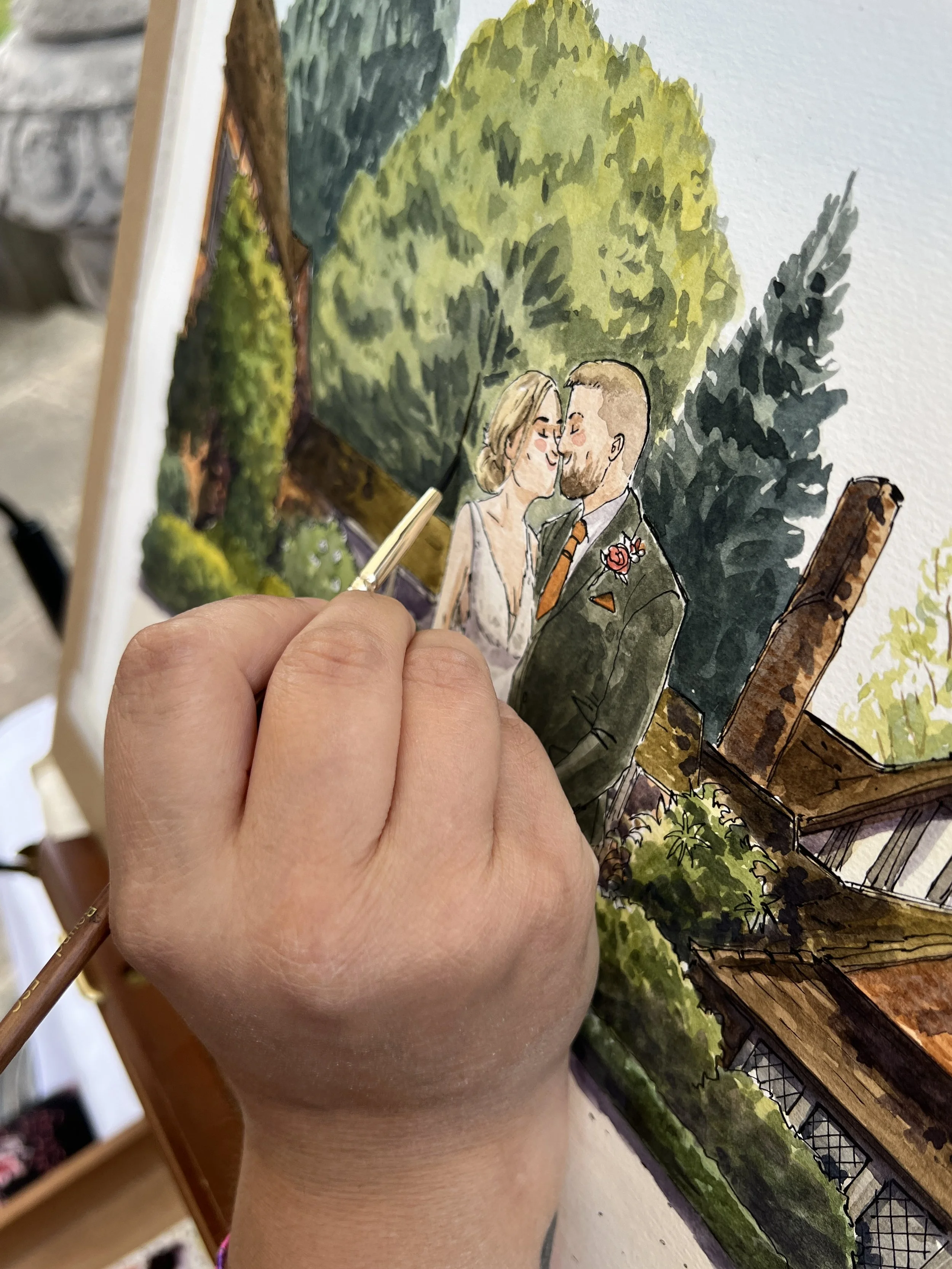 Hand painting a watercolor illustration of a couple kissing in a park with trees and a bench.