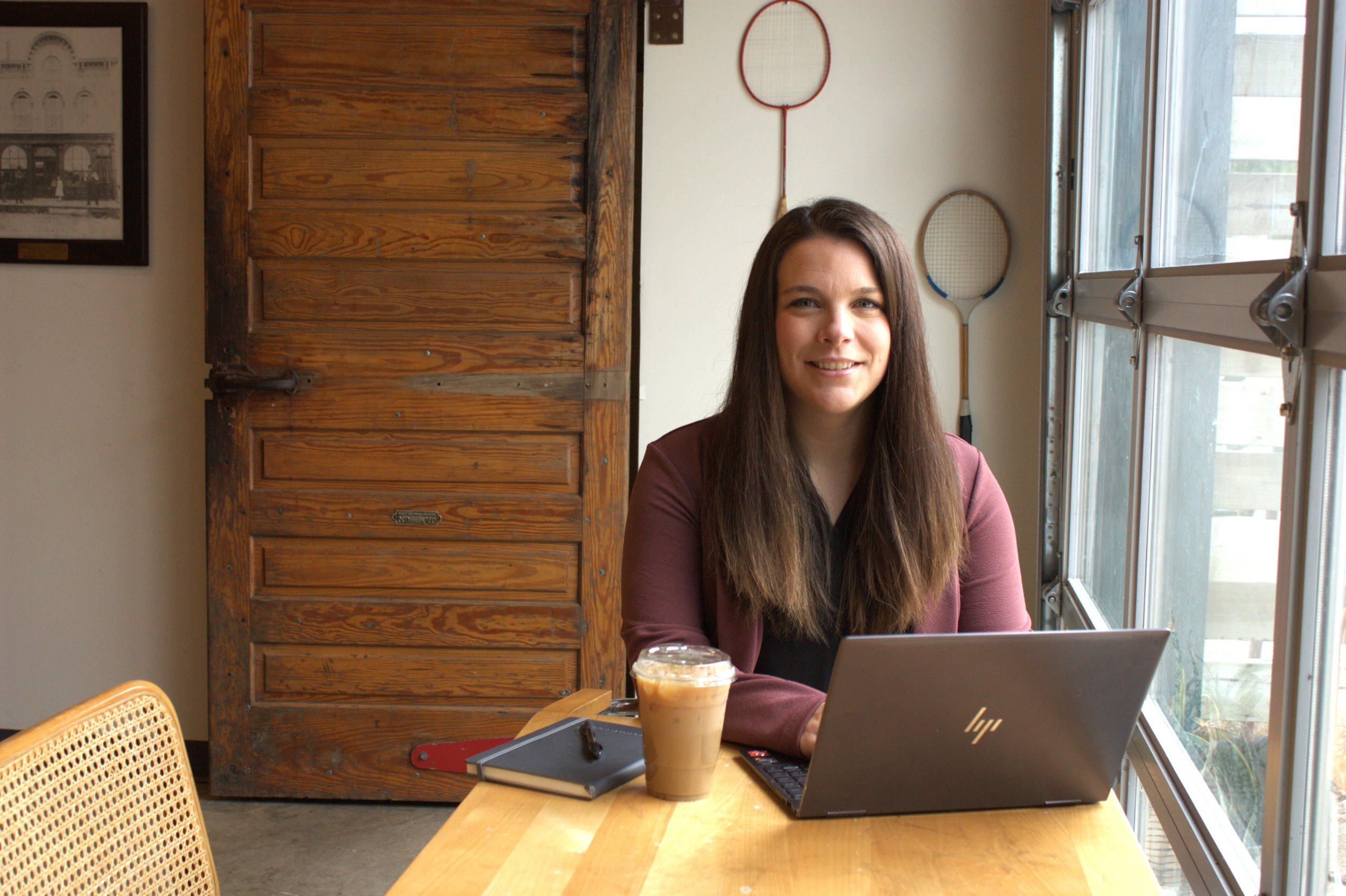 Grant strategy support specialist working on computer