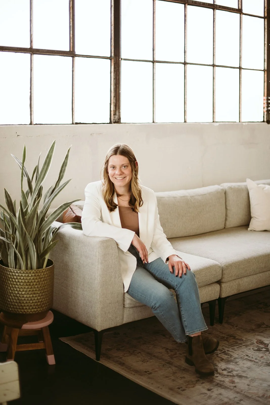 Midwest Grant Consultant sitting on couch