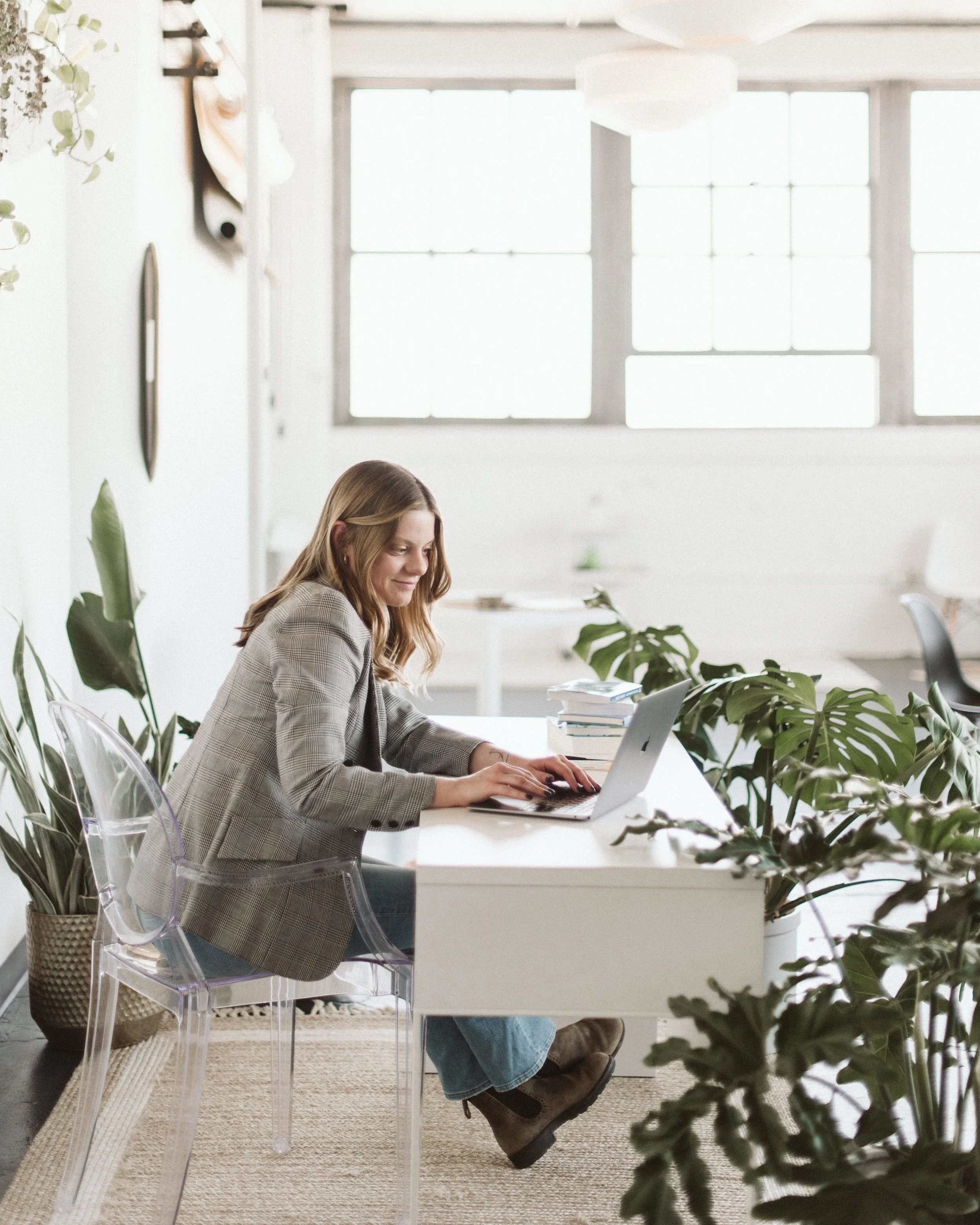 Sarah Mueller nonprofit grant writer sitting at desk