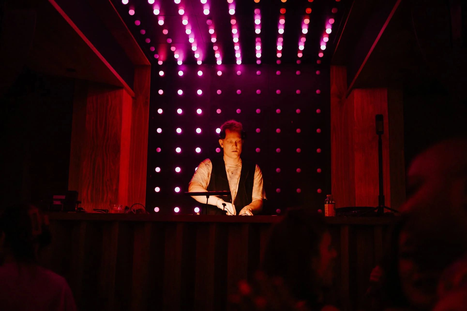DJ in club DJ booth