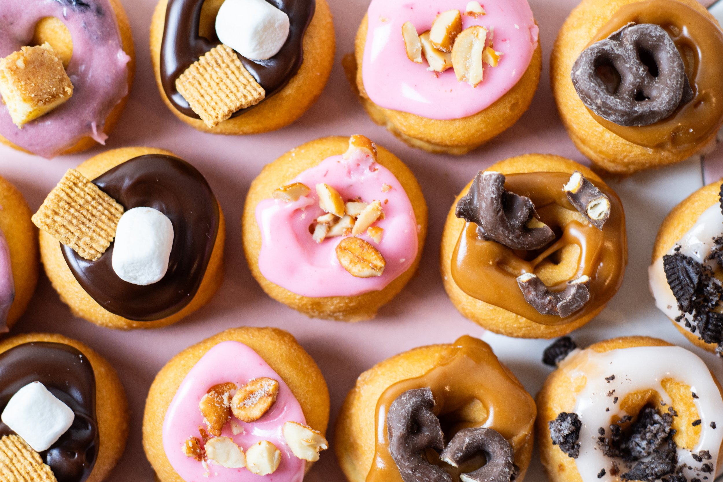 Zac Young's signature mini donuts with toppings for blueberry cheesecake, s'mores, pb&j, salted caramel pretzel, and cookies & cream