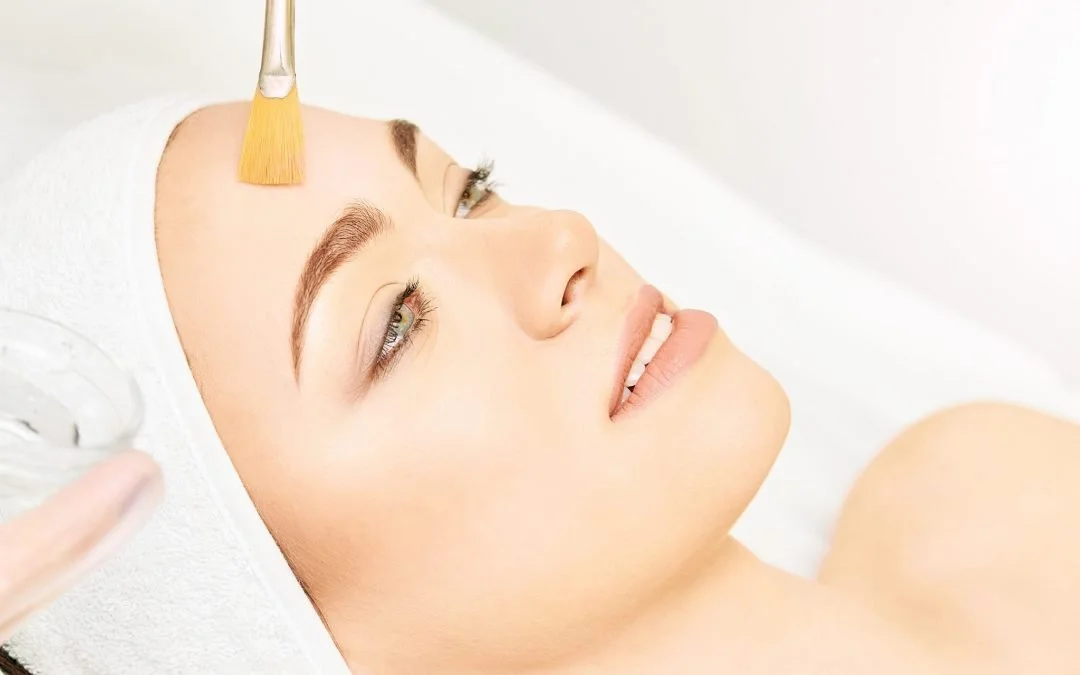 Woman receiving a facial treatment in a spa or skincare clinic