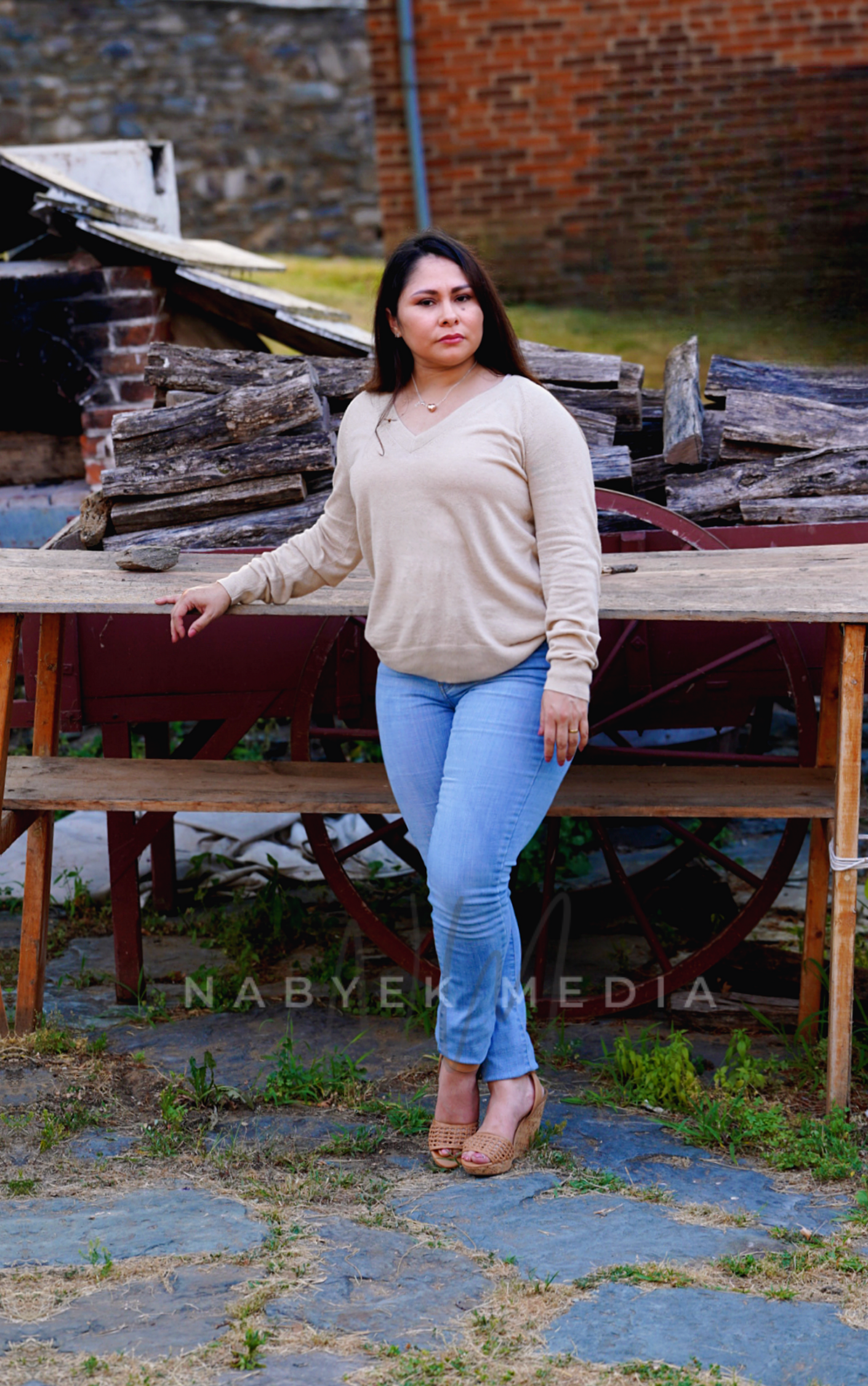 women p[osing in fromt of table