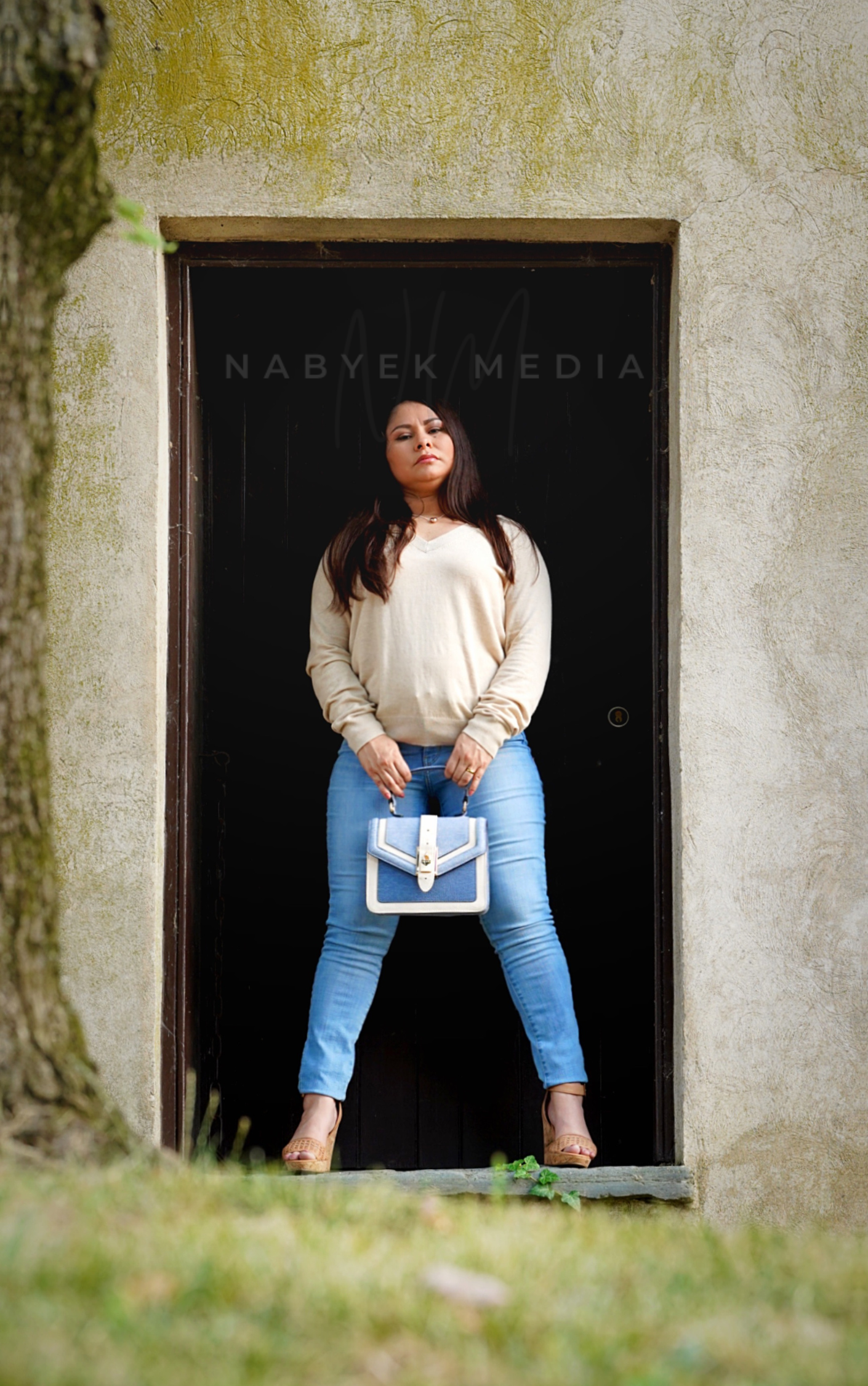 women posing in front of door