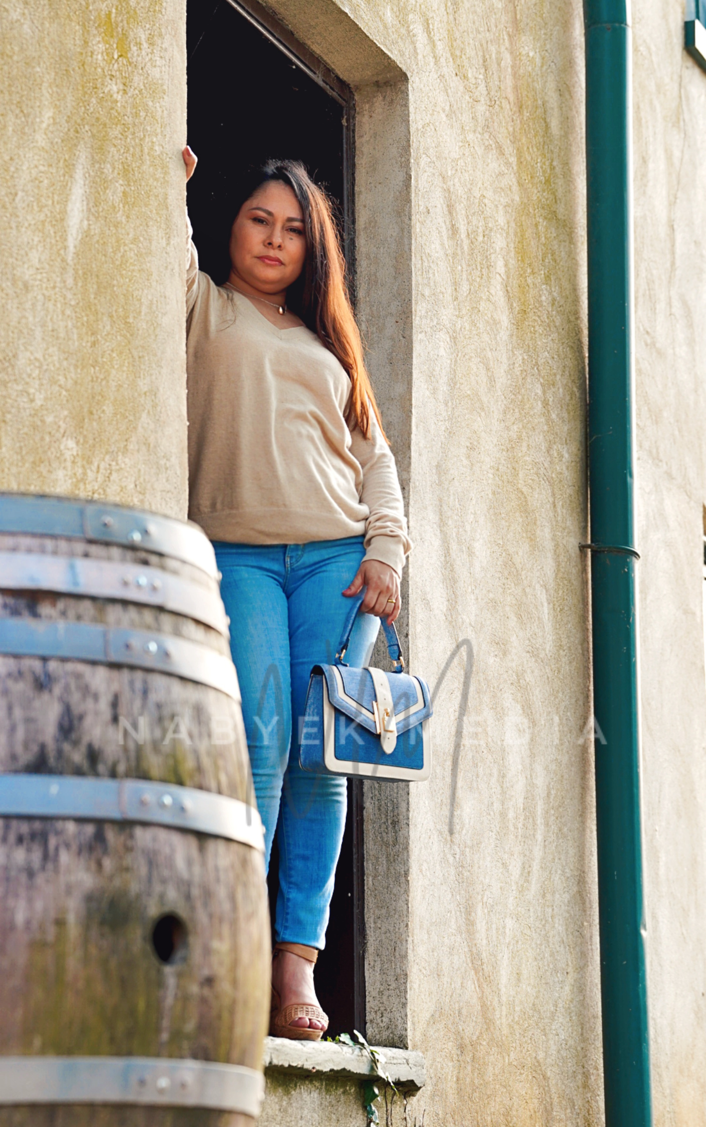 women posing standing in front of door