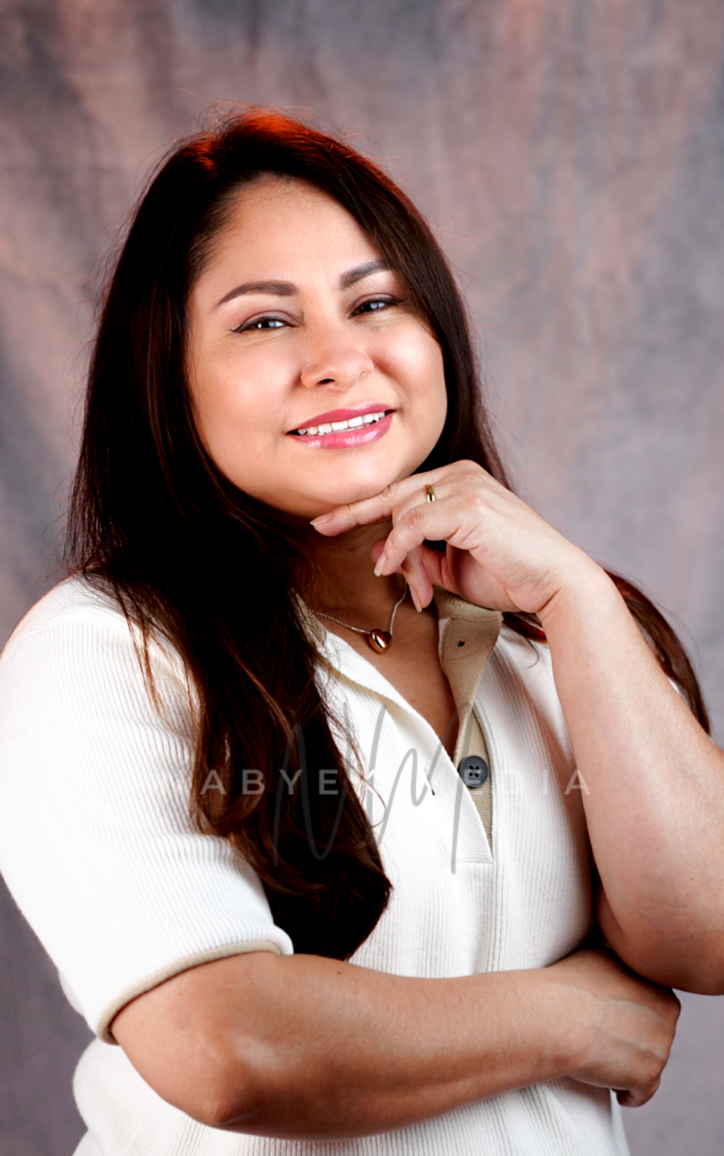 women smiling popsing arms crossed
