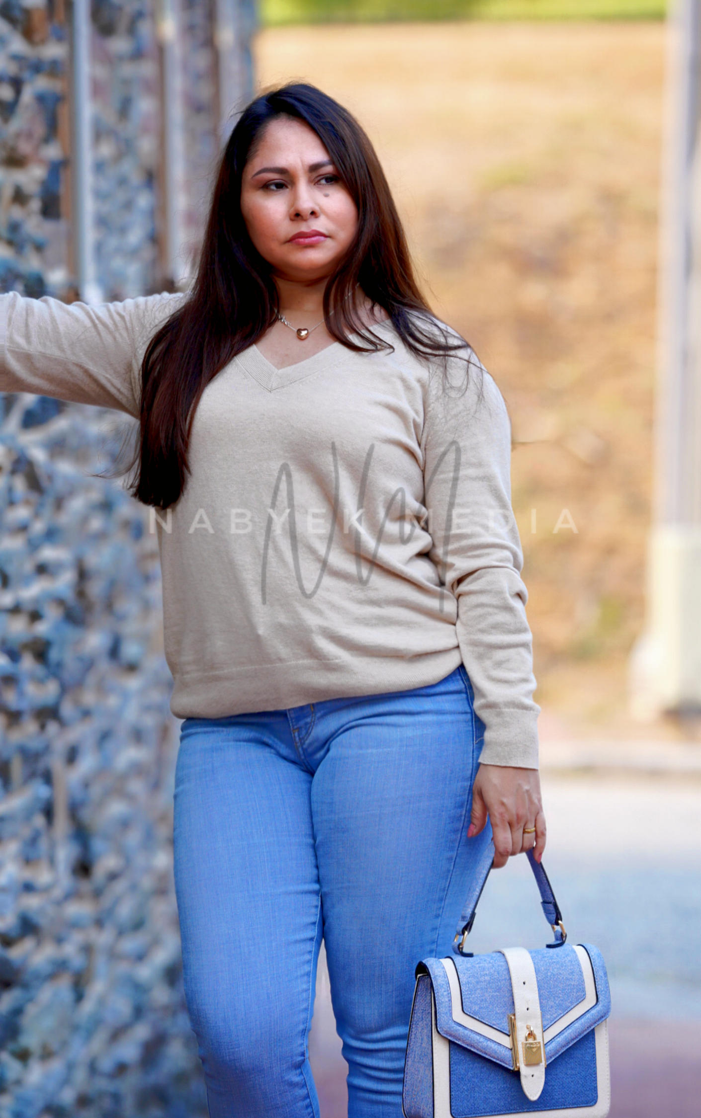 women posing on wall