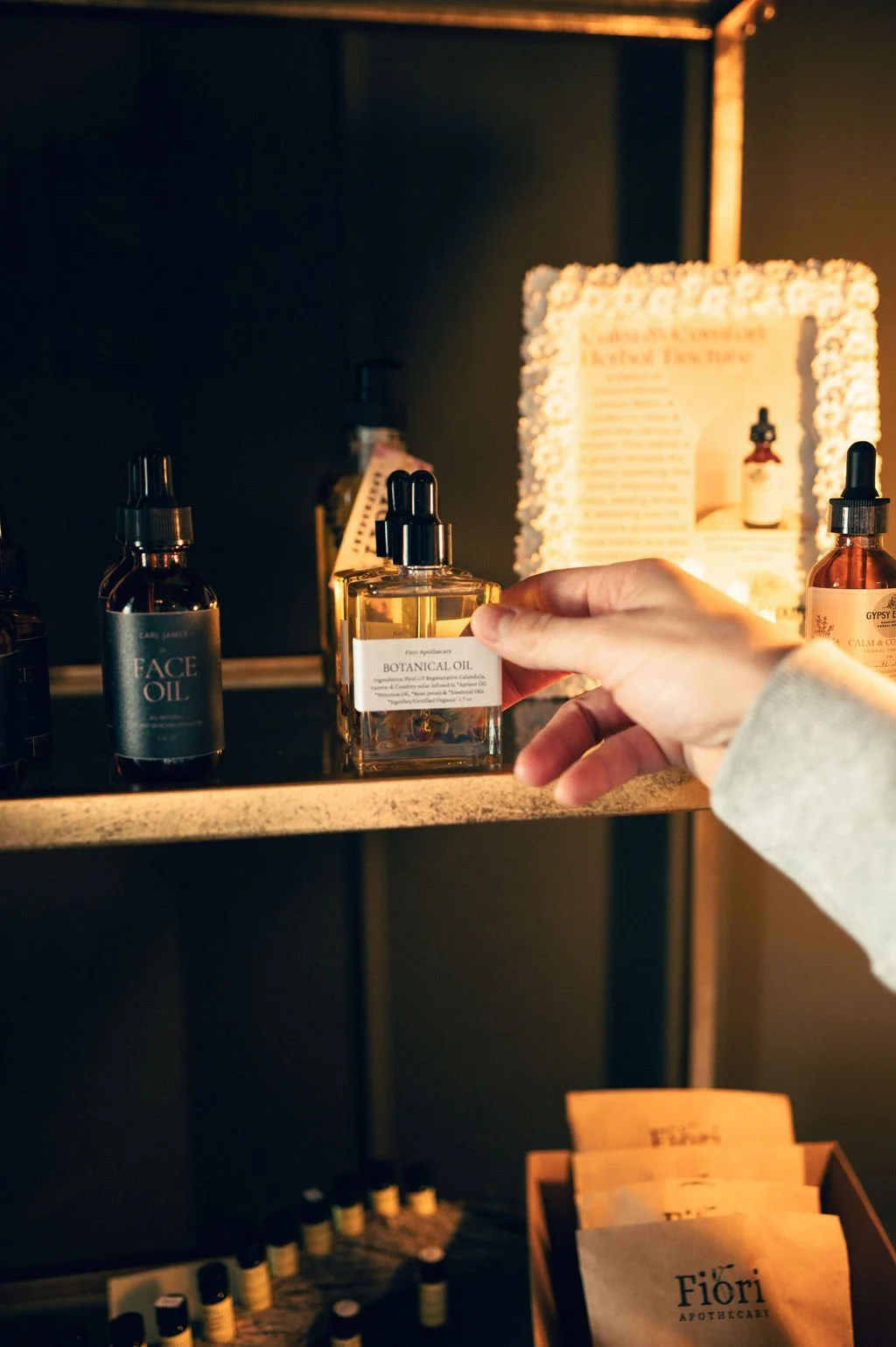 Botanical massage oil available for purchase at Kalm Sanctuary in Salt Lake City, crafted to support relaxation and skin nourishment