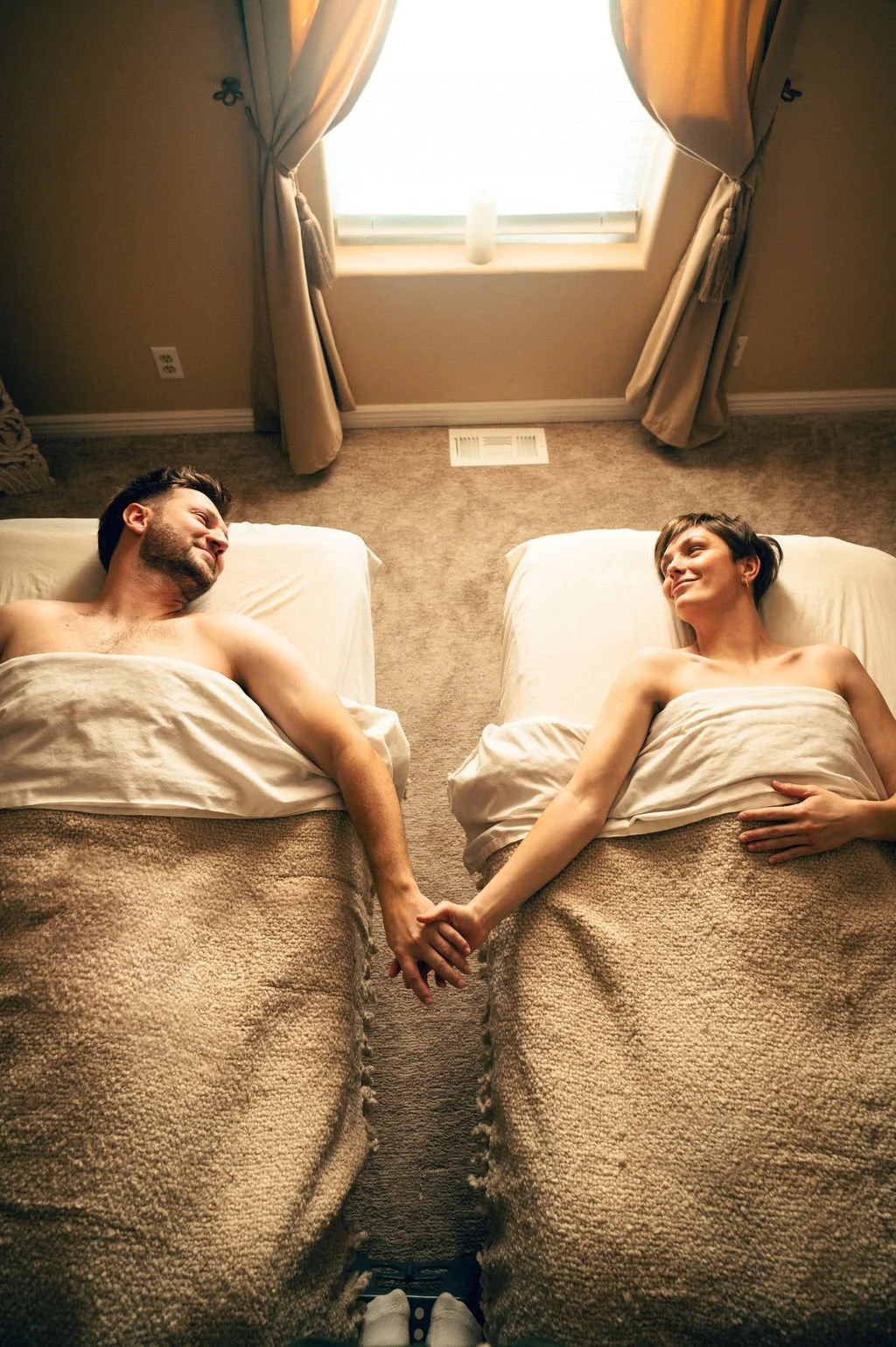 Couples massage in Salt Lake City at Kalm Sanctuary, featuring two guests receiving relaxing full-body massage in a calm, private spa setting