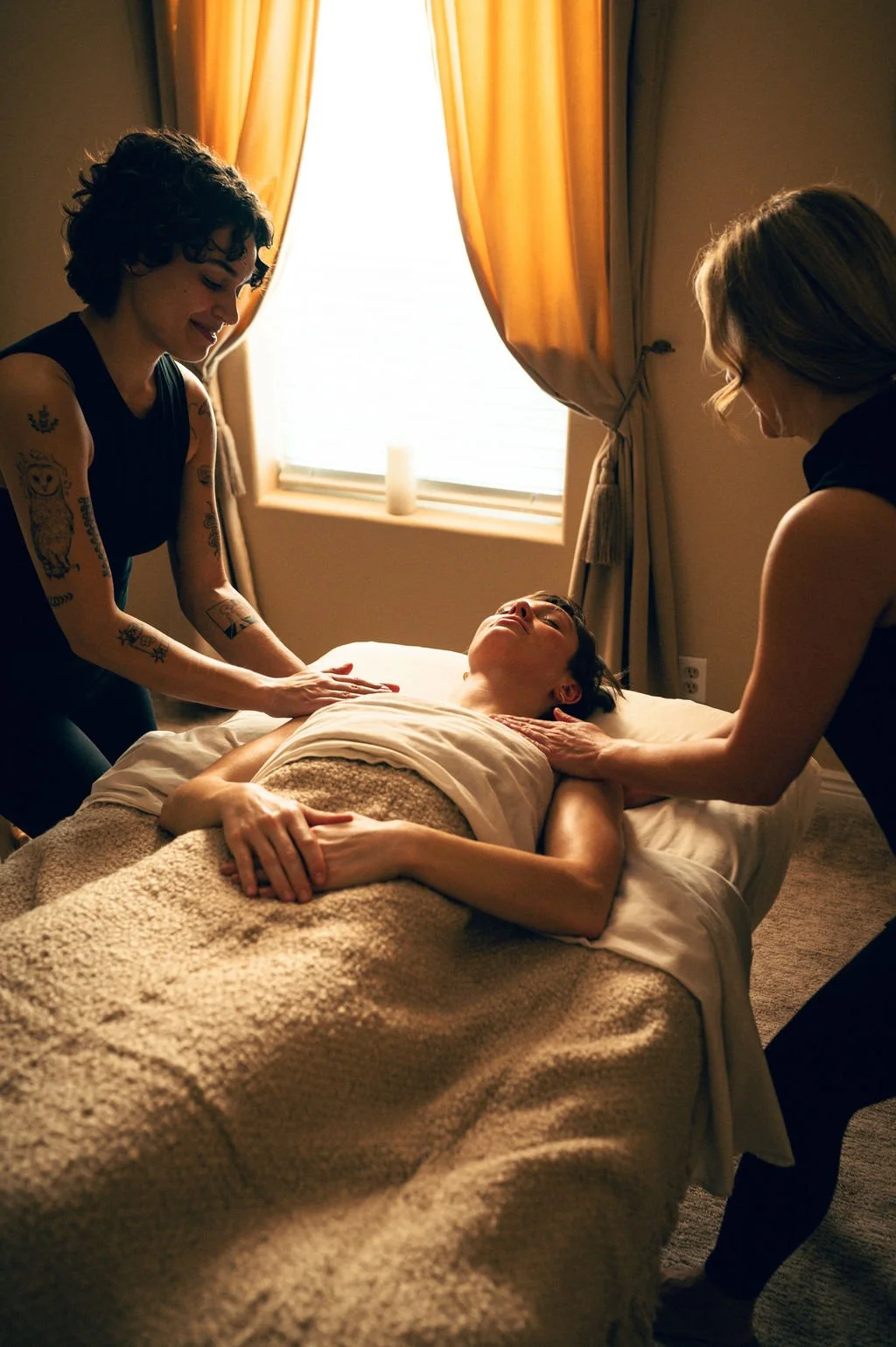 Four hand massage in Salt Lake City at Kalm Sanctuary, featuring two therapists performing synchronized full-body massage for deep relaxation